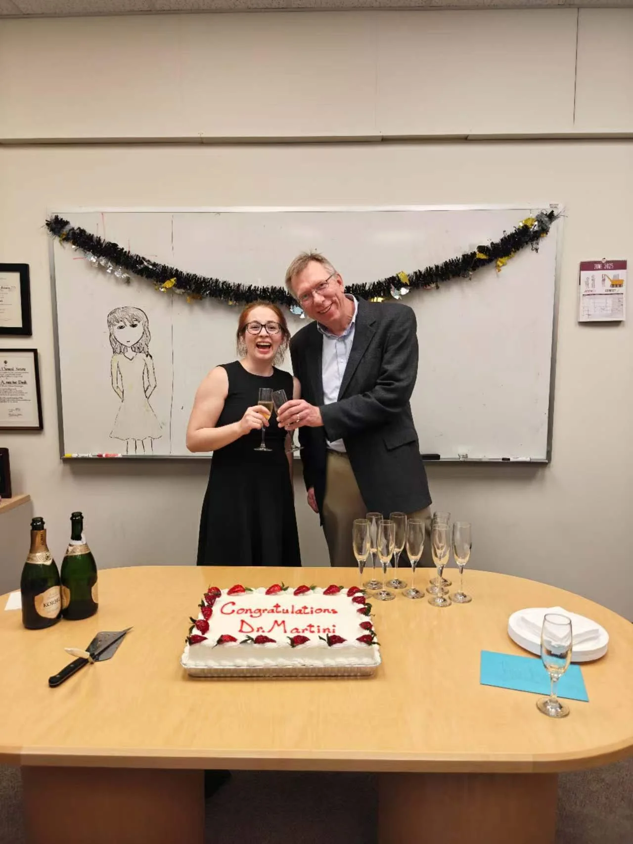 Wilfred and Rachel celebrating. Congratulations Dr. Martini!