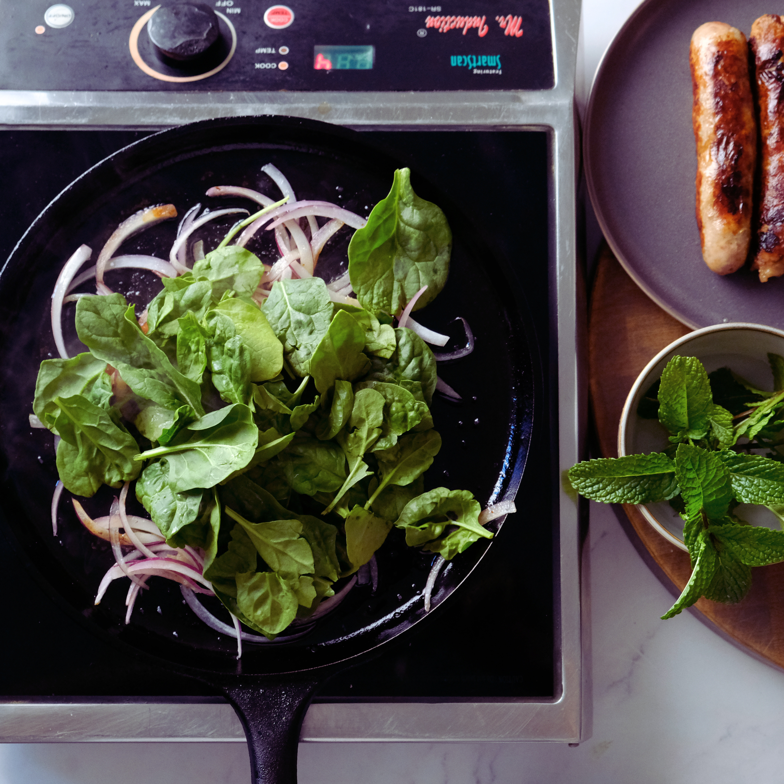 sauted red onions and baby spinach.png