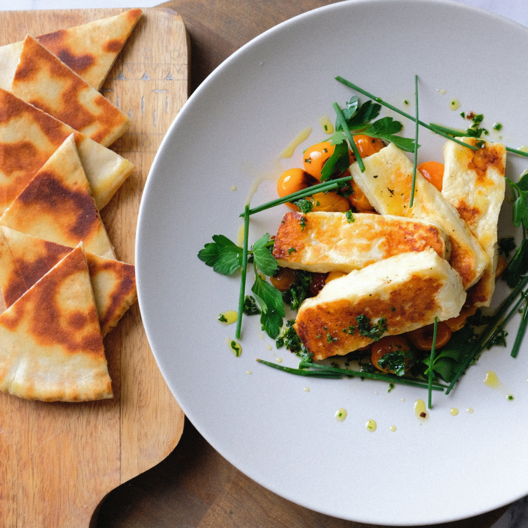 the chef's press holloumi cheese, chard tomatoes, pita bread.png
