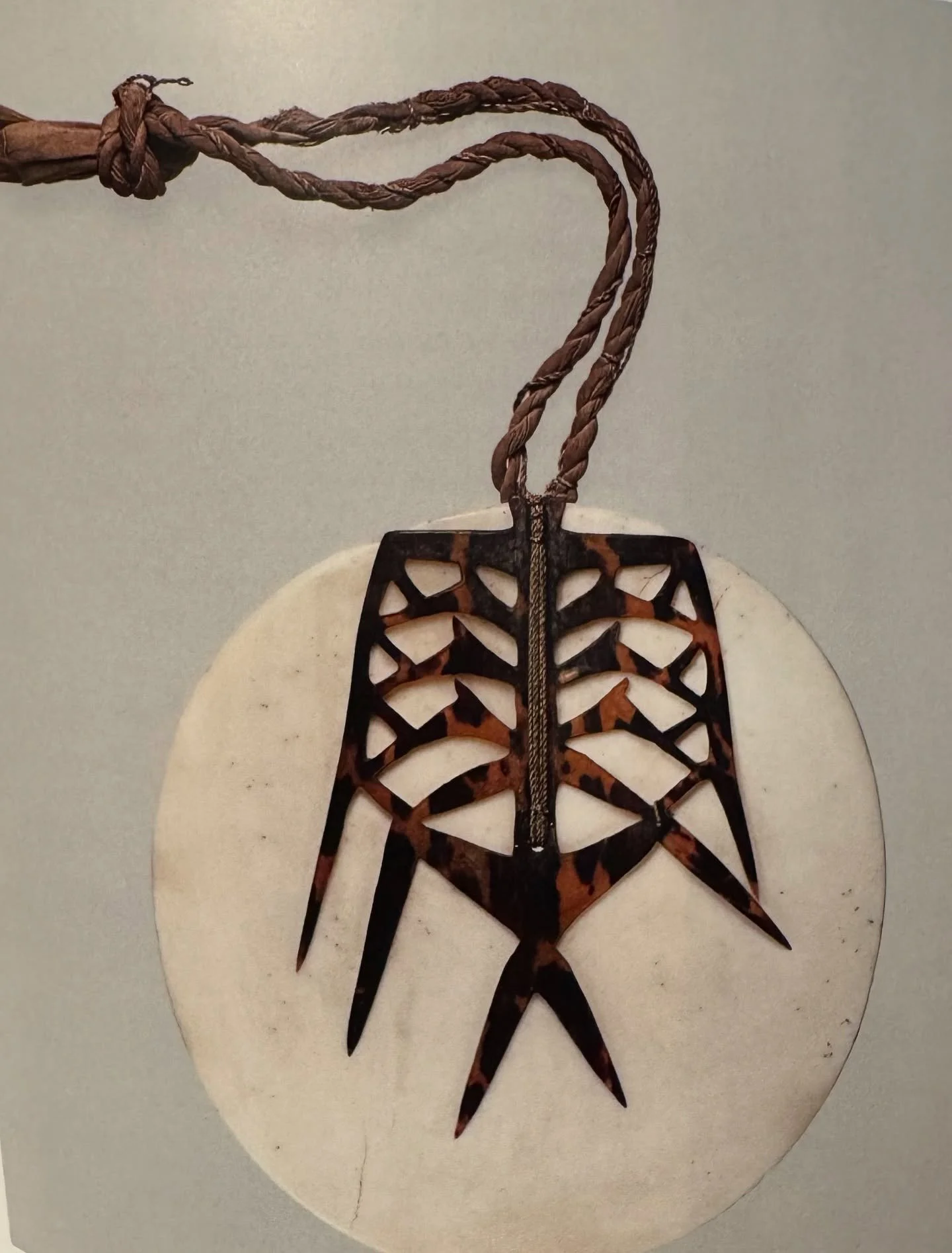 Breastplate (Tema, tambe, or tepātu)

Solomon Islands, Santa Cruz Island&rsquo;s
19th-early 20th century 
Tridacna shell, turtle shell, trade cloth, fiber
Diam 7 3/4 inches
The Michael C. Rockefeller Memorial Collection, Bequest of Nelson A. Rockefel