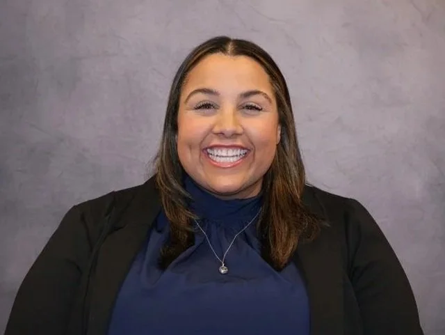 Brigitte Jean-Louis in a blue and white striped shirt, promoting peace, YWCA Princeton