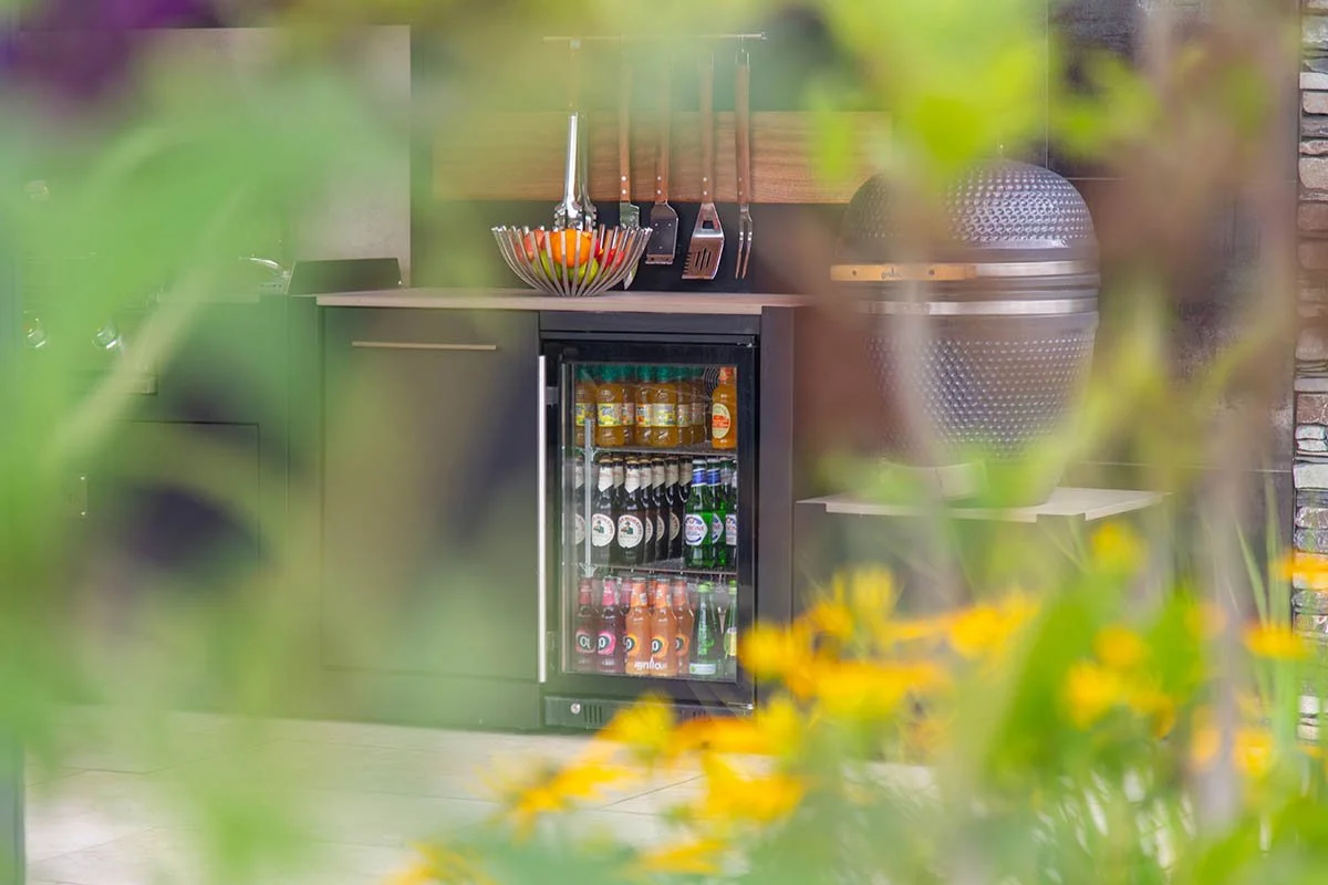 Grillo Outdoor Kitchens - Fridge Behind Foliage.jpg