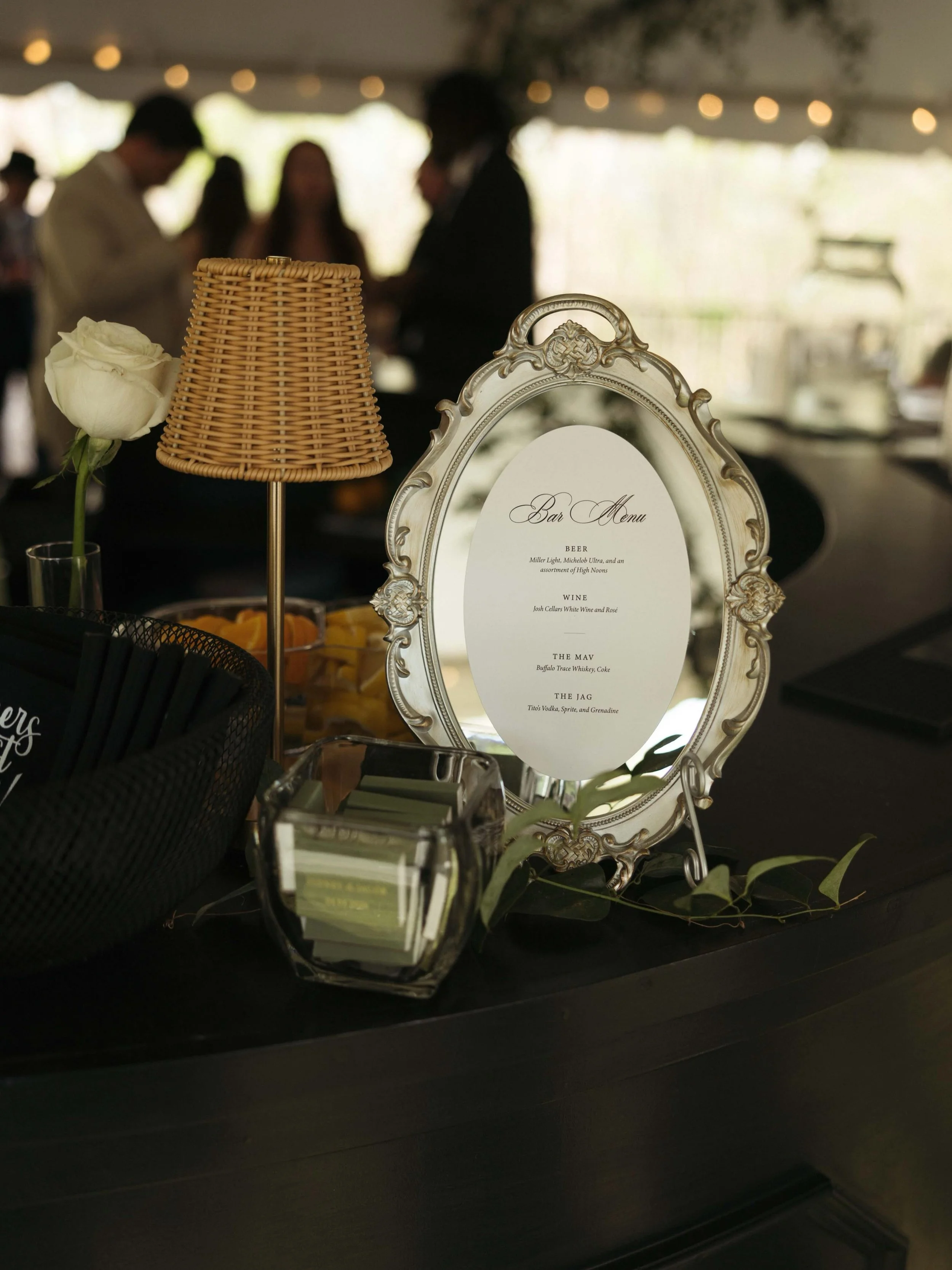 Some of my favorite wedding details are the ones that feel both beautiful and deeply personal.

For this celebration, we incorporated custom chair ribbons, vintage inspired bar signage, and an In Loving Memory display honoring those who couldn't be t