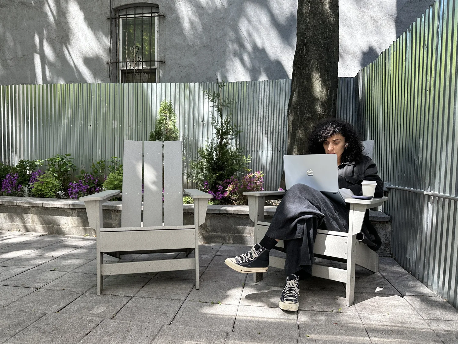 A Work Heights coworking member at her desk in Brooklyn