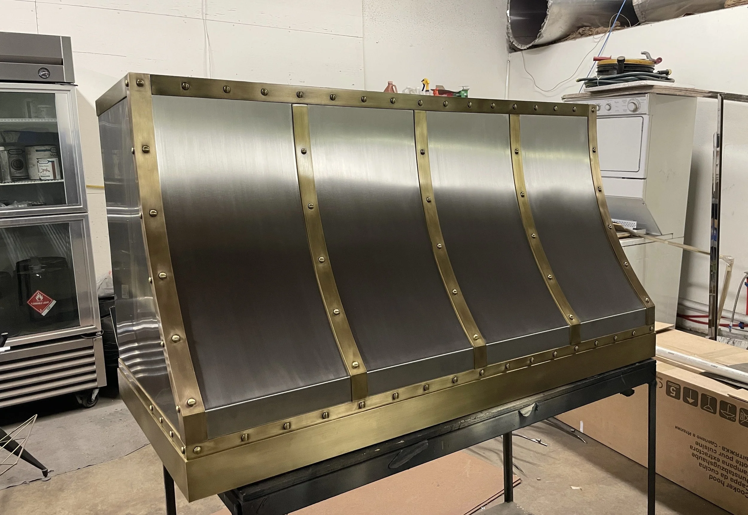 Custom Stainless Steel Range Hood with Antique Brass Straps — Monarch