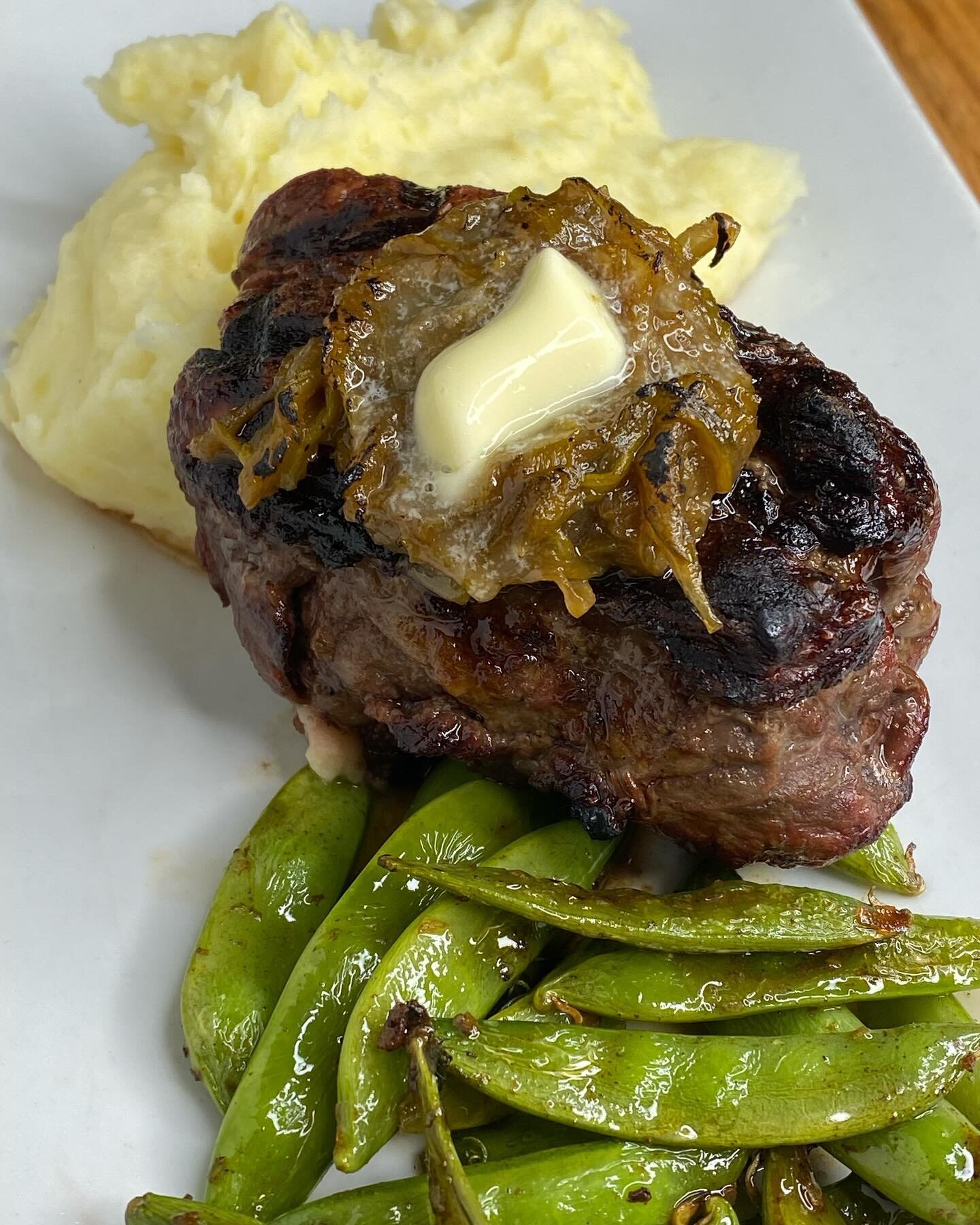 CAB tenderloin, mashed potatoes, sugar snap peas and caramelized leaks