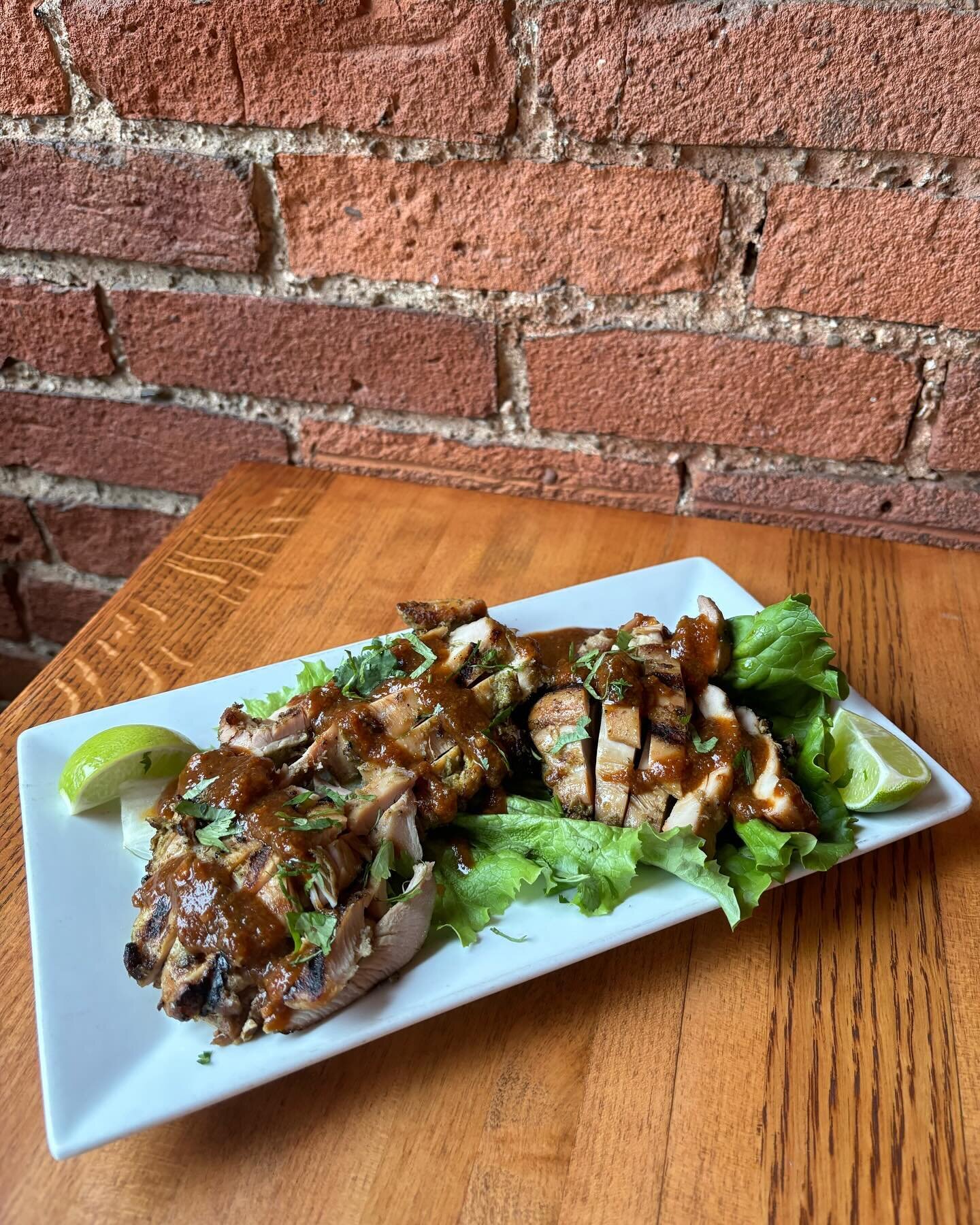 Jerk Chicken - Grilled Jerk Chicken, Peach BBQ, Lettuce, Lime, Cilantro