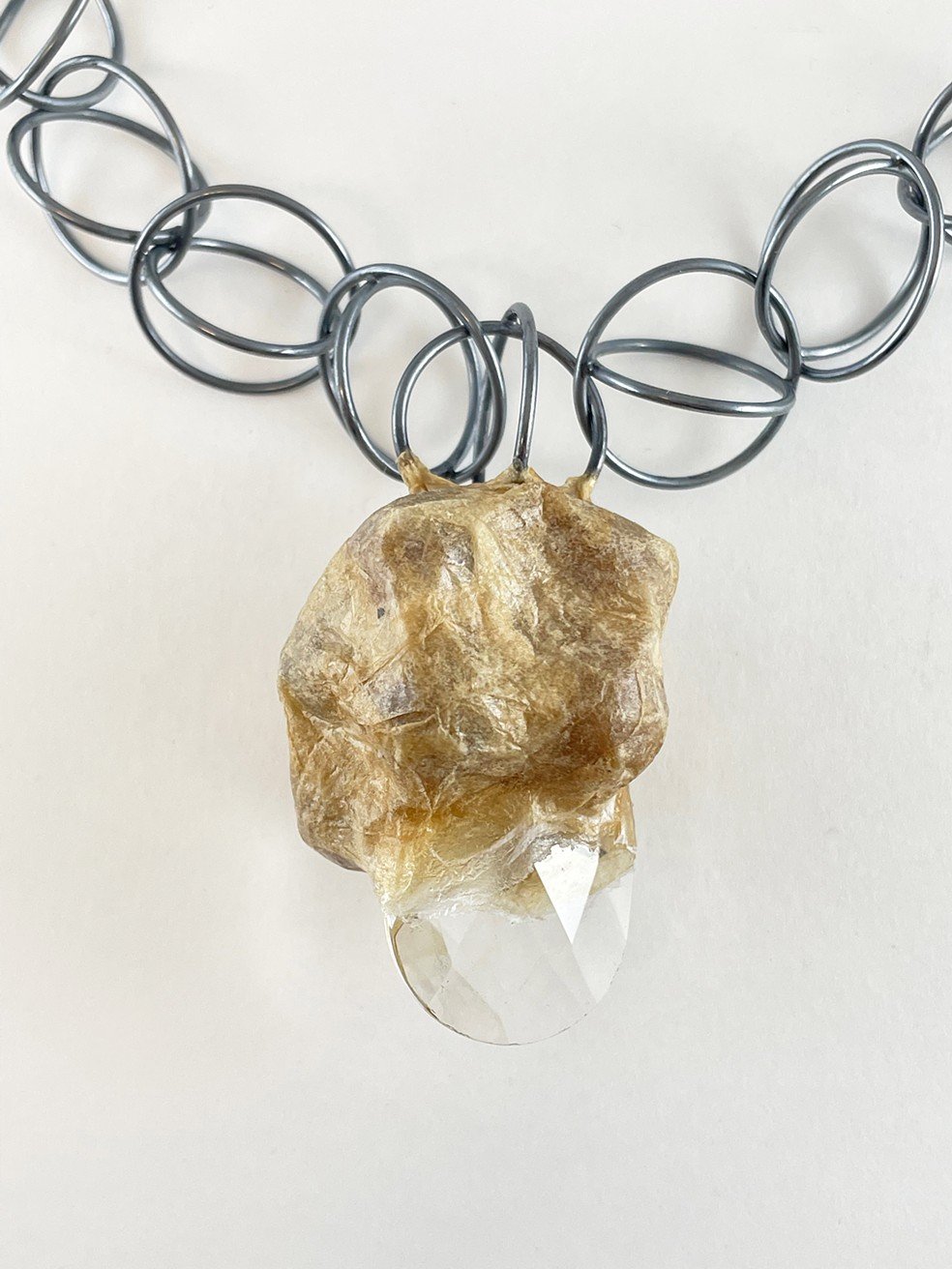 Two objects from Burden are included in the 2023 Biennial Faculty Exhibition - a necklace and a brooch.