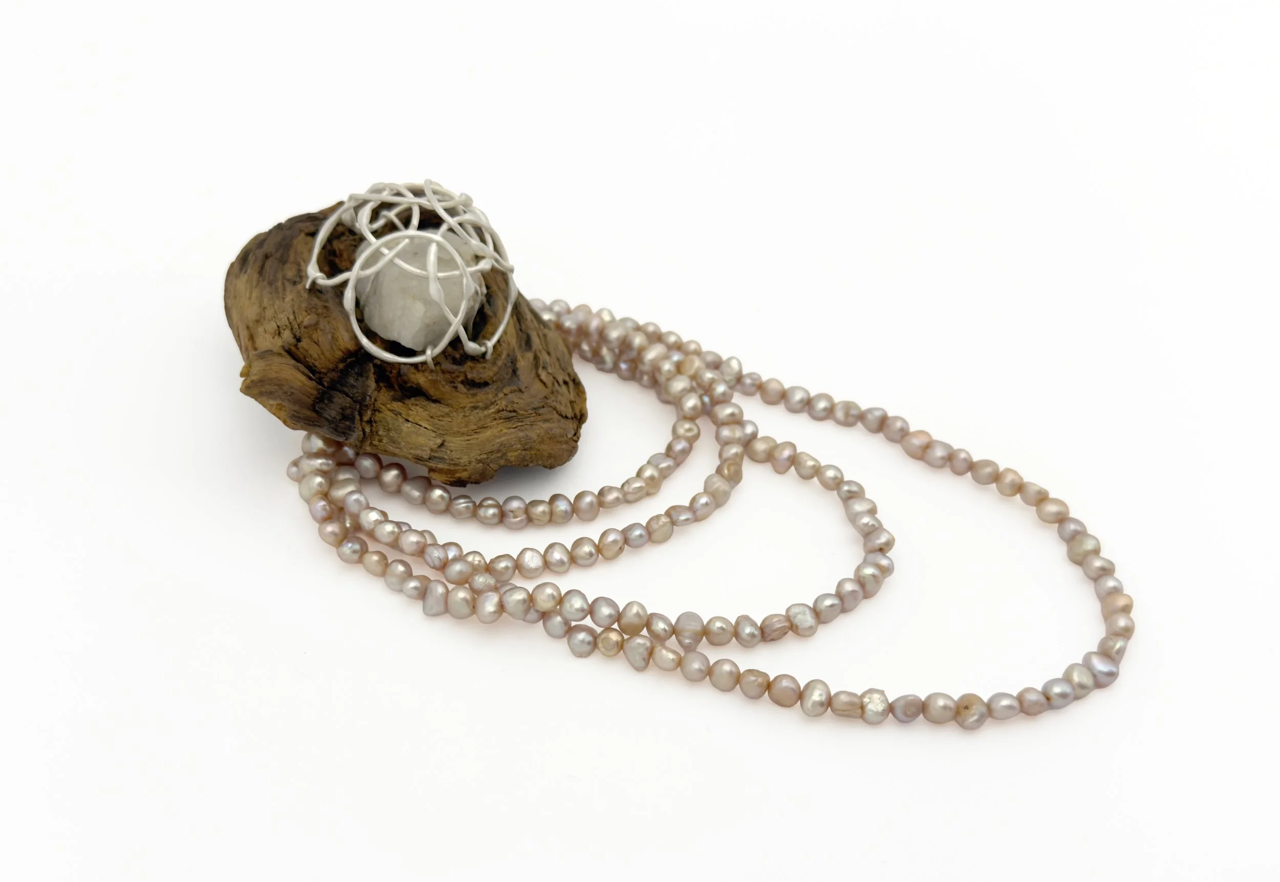 breathe 24 (brooch)
recycled silver, found wood, found quartz, repurposed natural pearls
6 1/2" x 2 1/2" x 1 1/2"
2026