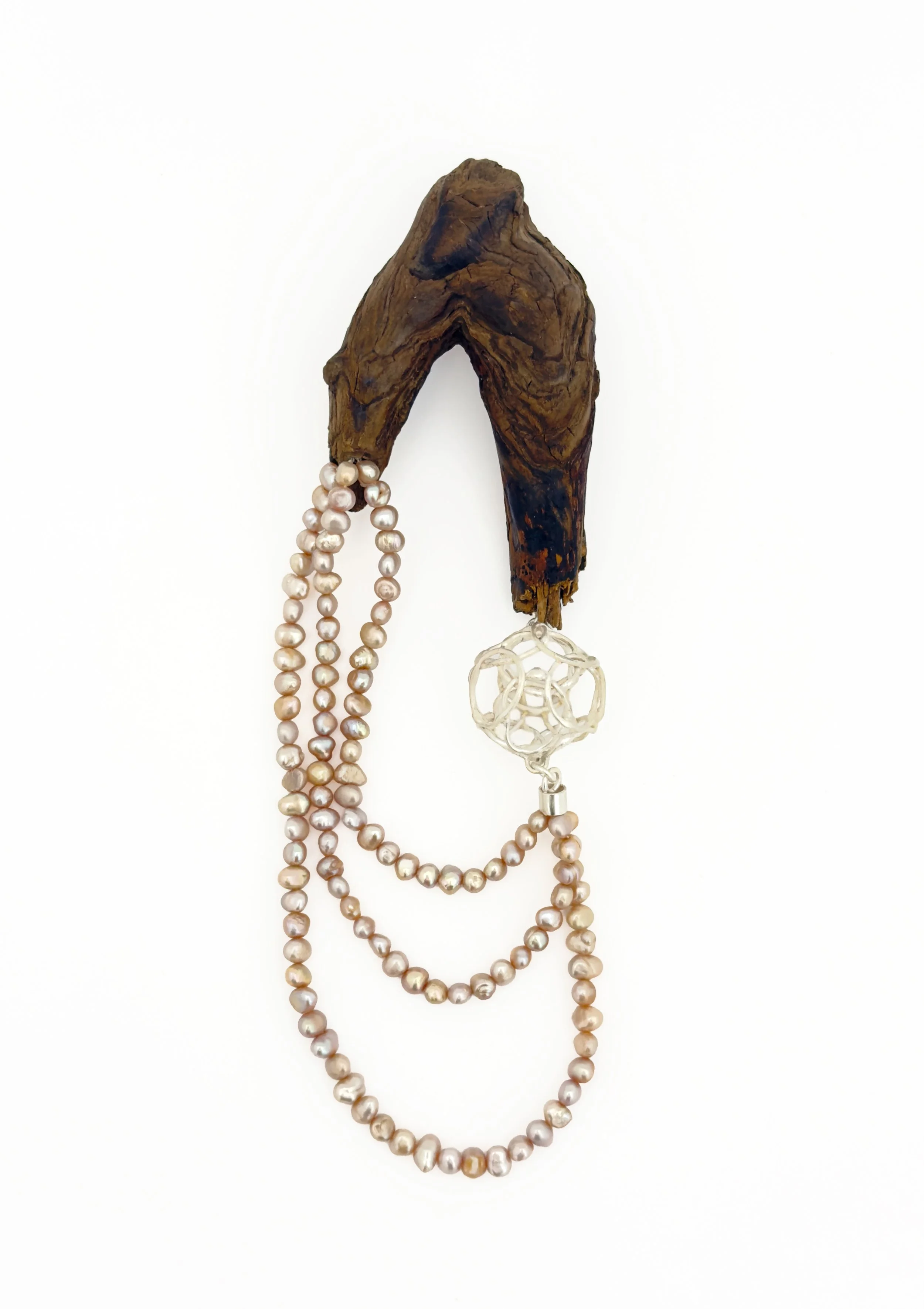 breathe 25 (brooch)
recycled silver, found wood, repurposed natural pearls
7” x 2 ½” x 1”
2026