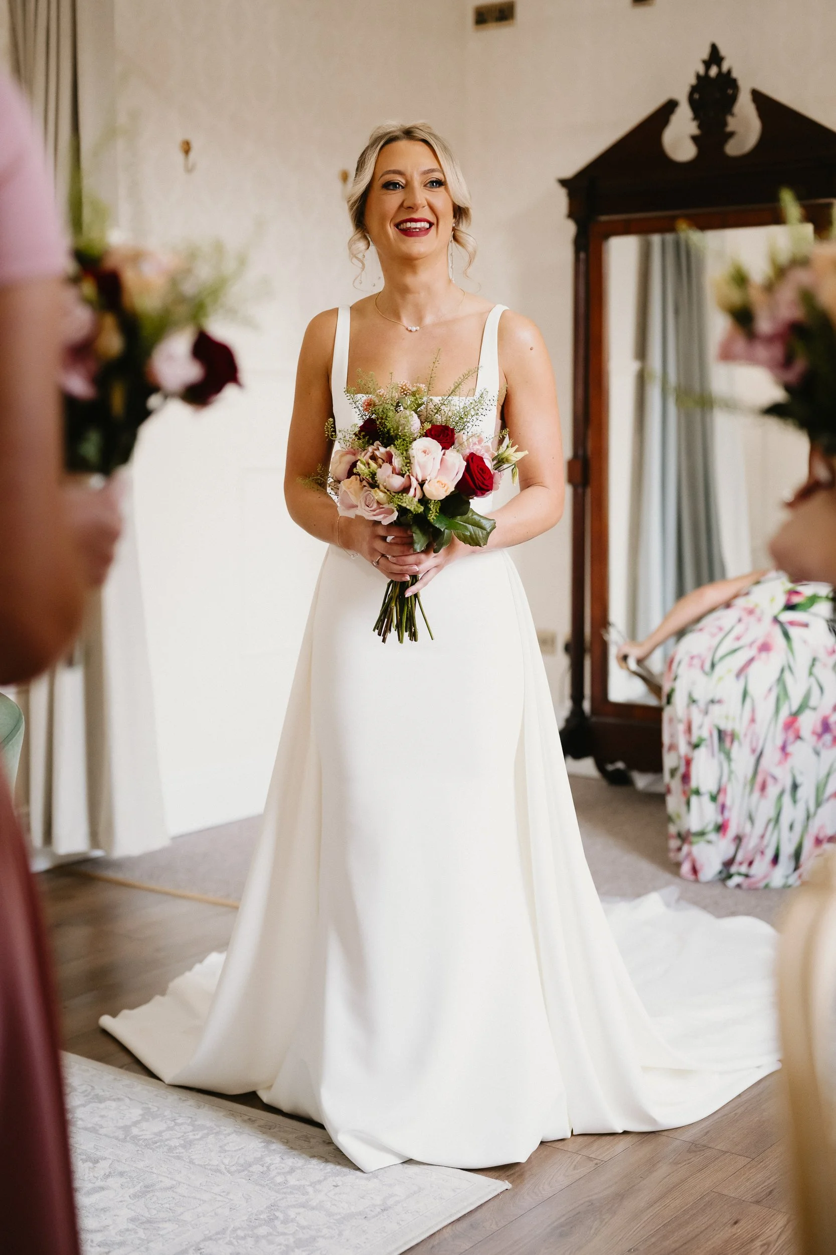 ride reveal to bridesmaids at Netley Hall during a winter wedding morning