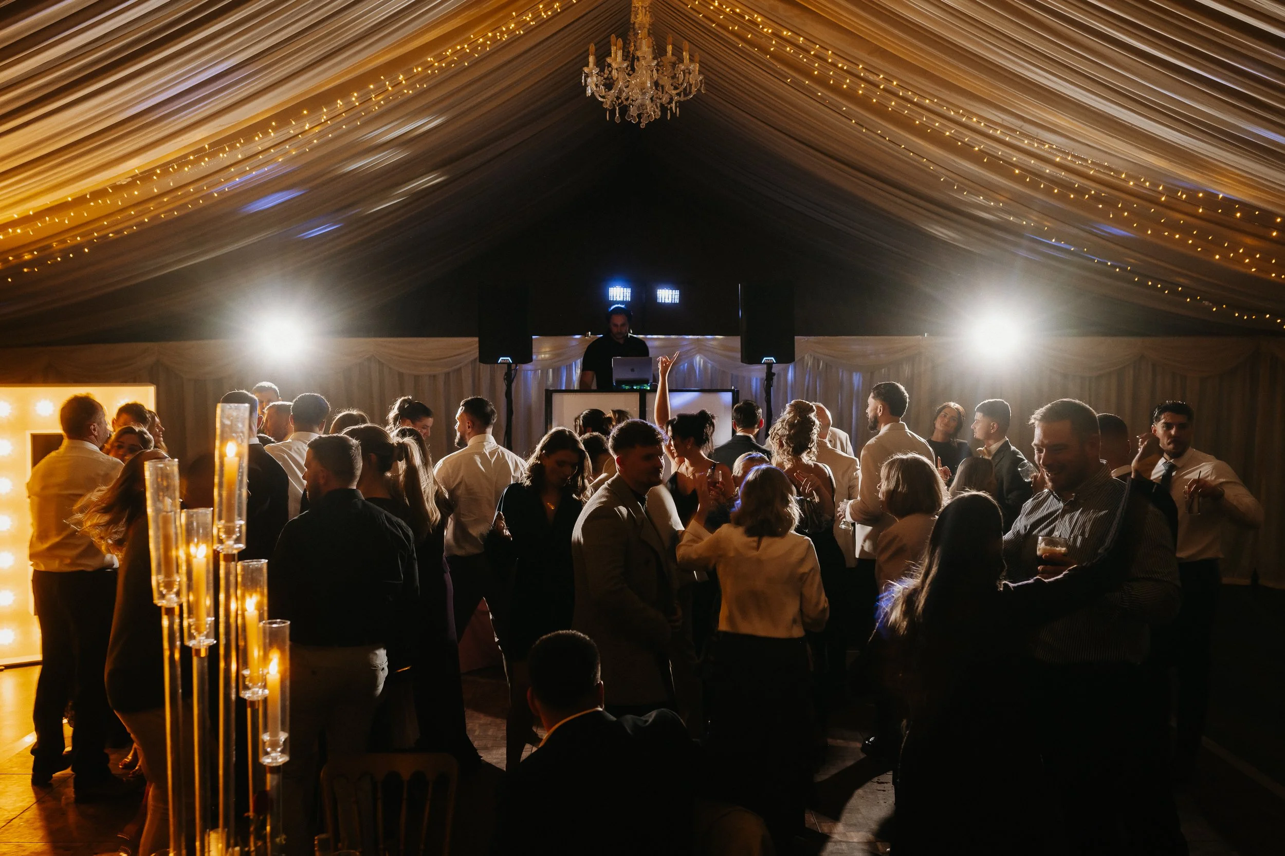 Packed dance floor during the winter wedding reception at Netley Hall, with guests dancing and celebrating late into the evening.