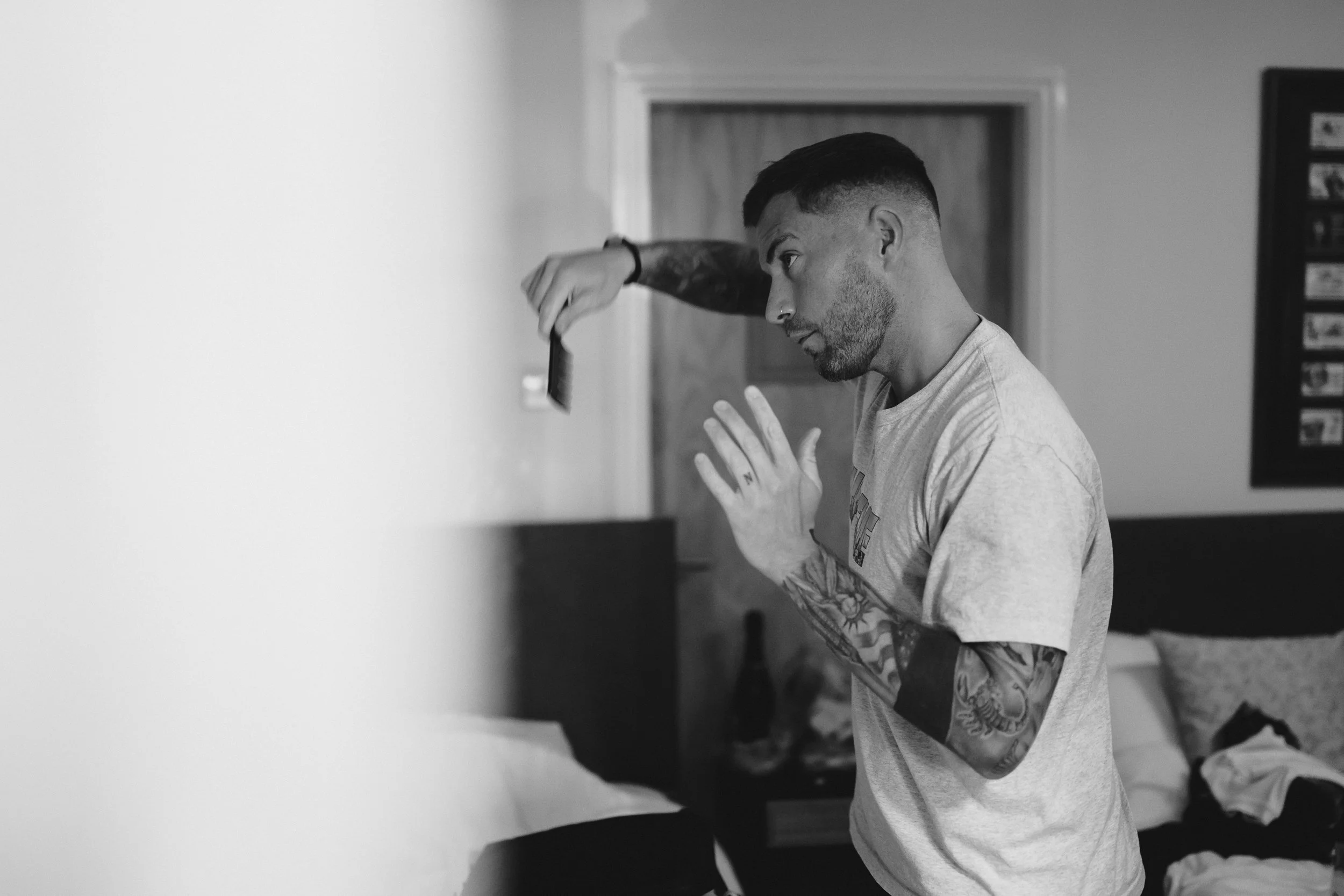 Groom getting ready before ceremony at Netley Hall winter wedding