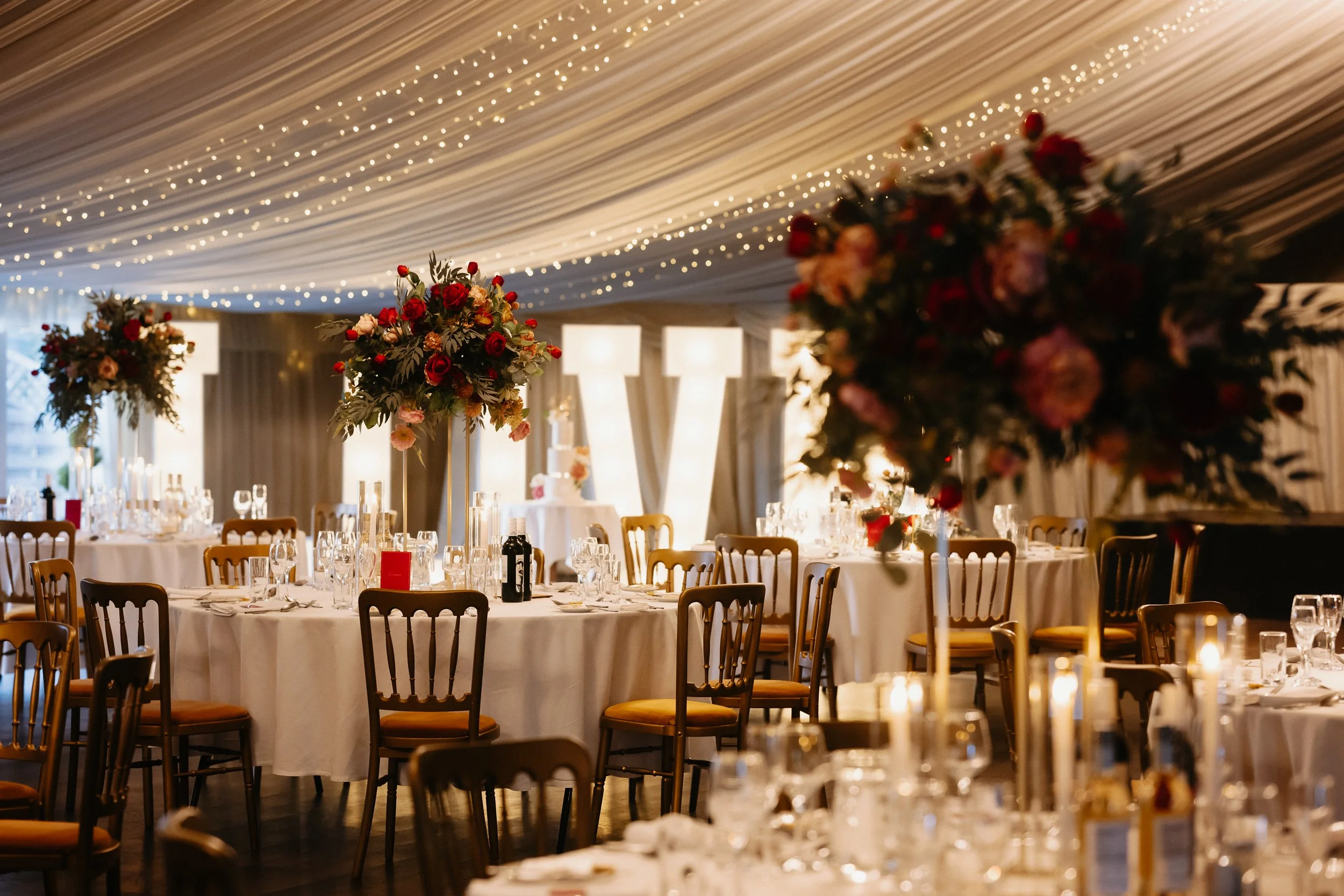 Wedding breakfast room set up inside Netley Hall, beautifully decorated with floral and styling details by Katrina Creates Designs for a winter wedding reception.