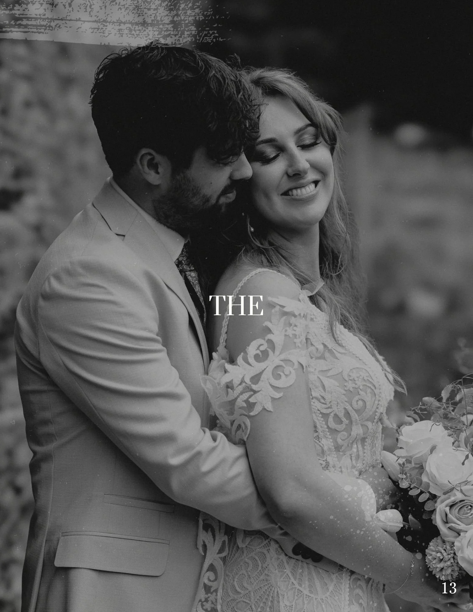 A black and white photo of a bride and groom embracing outdoors, with the word "THE" overlaid in the center.
