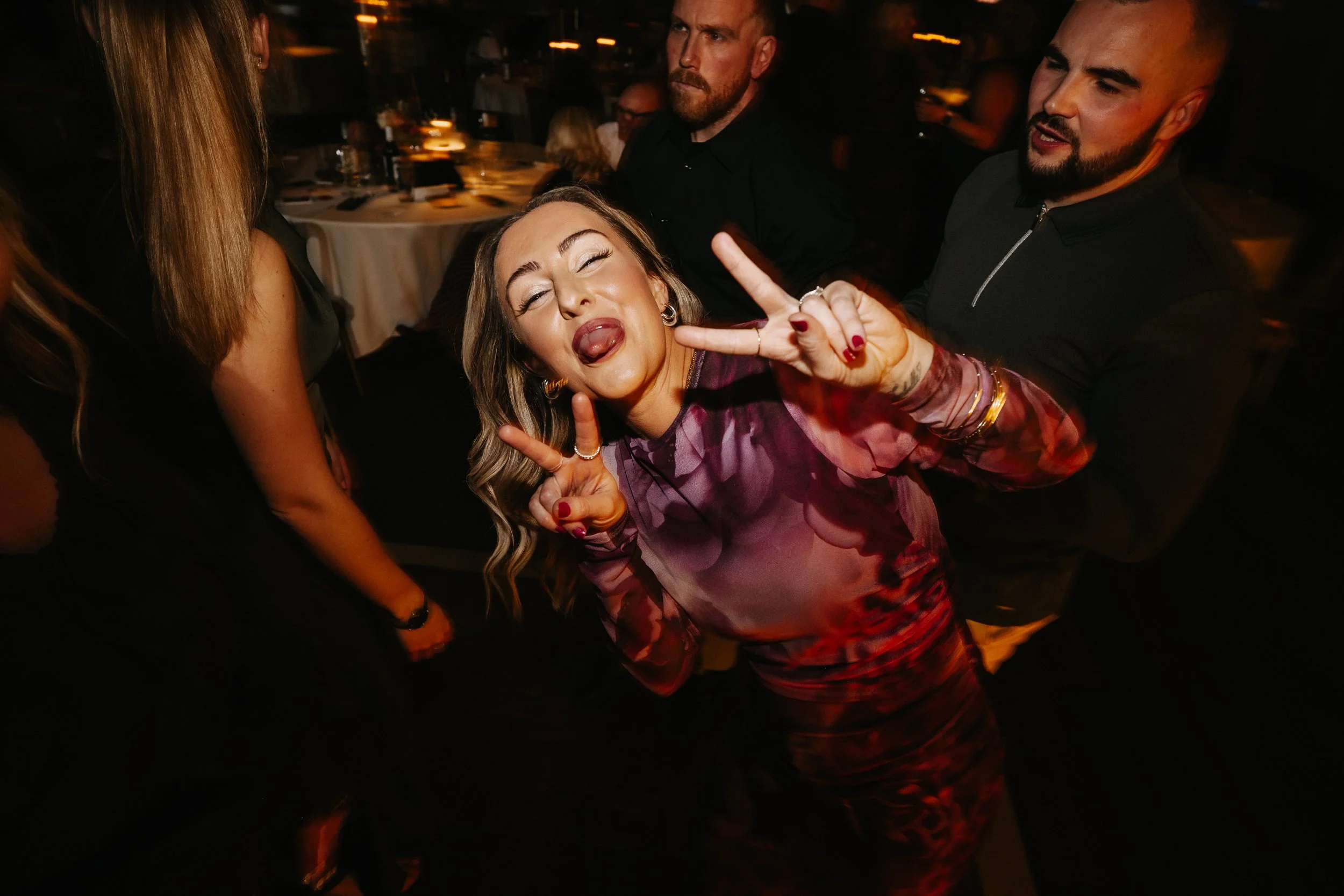 Packed dance floor during the winter wedding reception at Netley Hall, with guests dancing and celebrating late into the evening.