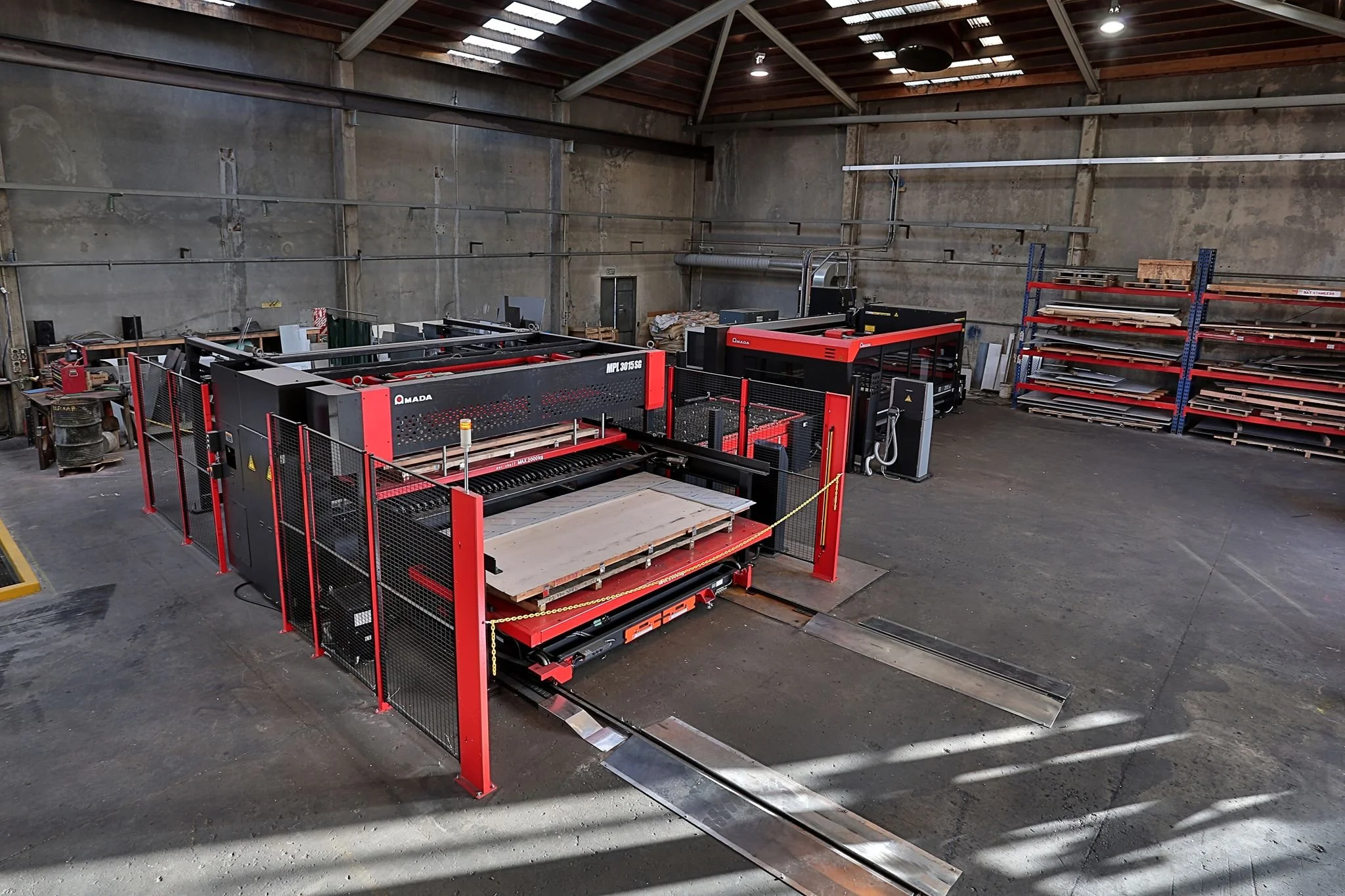 An industrial machine in a warehouse at Sheet Metalcraft Southland