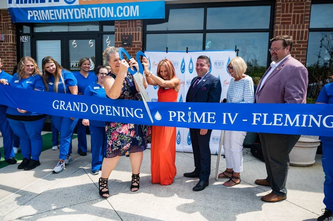 Ribbon cutting at a grand opening planned by June Beri Events