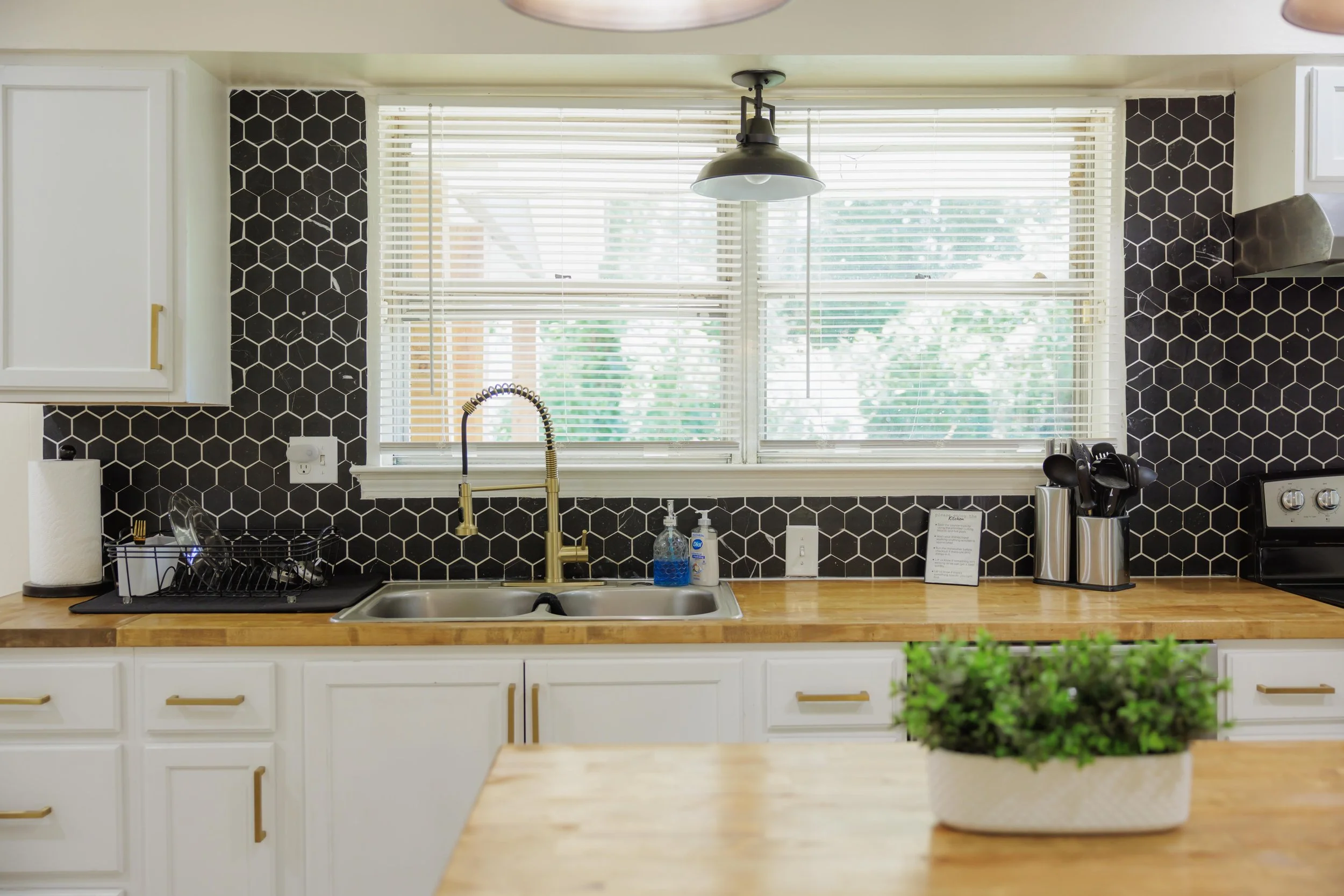 A fully equipped kitchen with warm wood finishes and thoughtful details for everyday living.