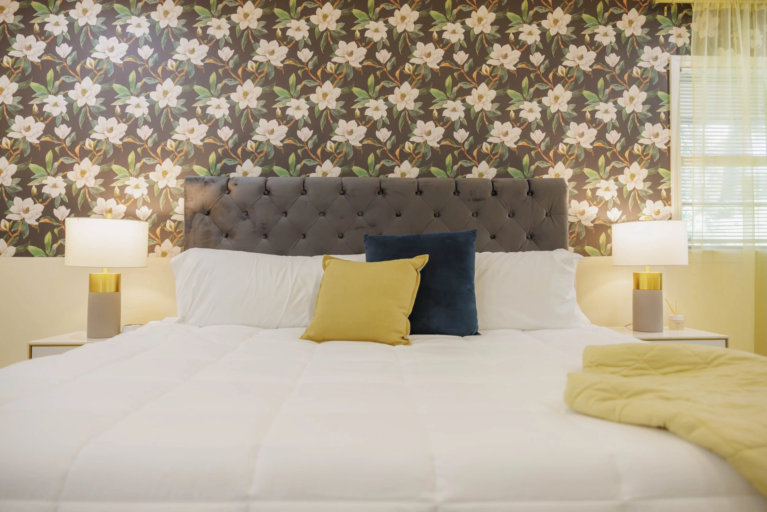 Plush bedding and rich textures give the room a relaxed, welcoming atmosphere.