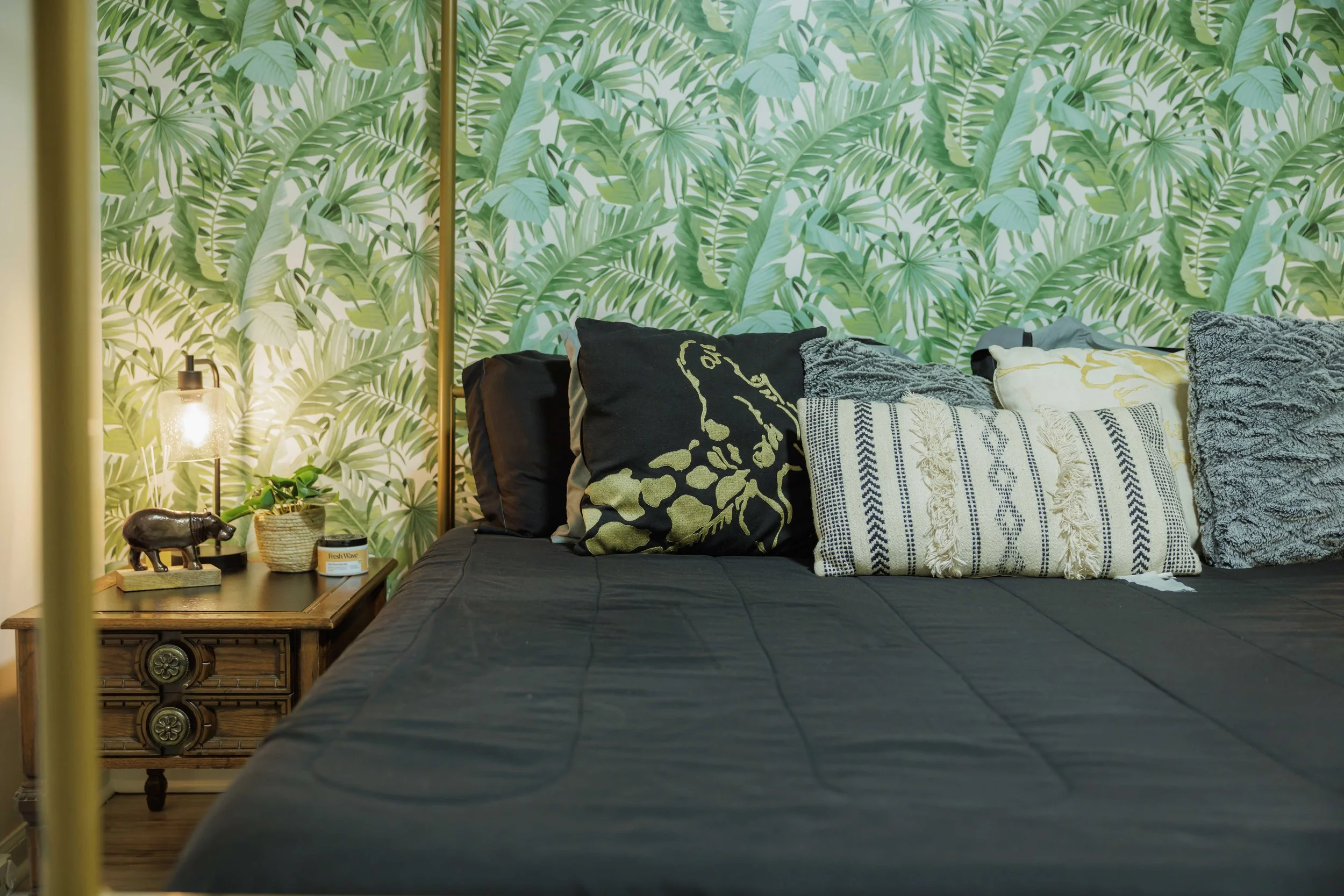 Layered bedding, soft textures, and calming lighting create a restful bedroom designed for everyday comfort in Memphis.
