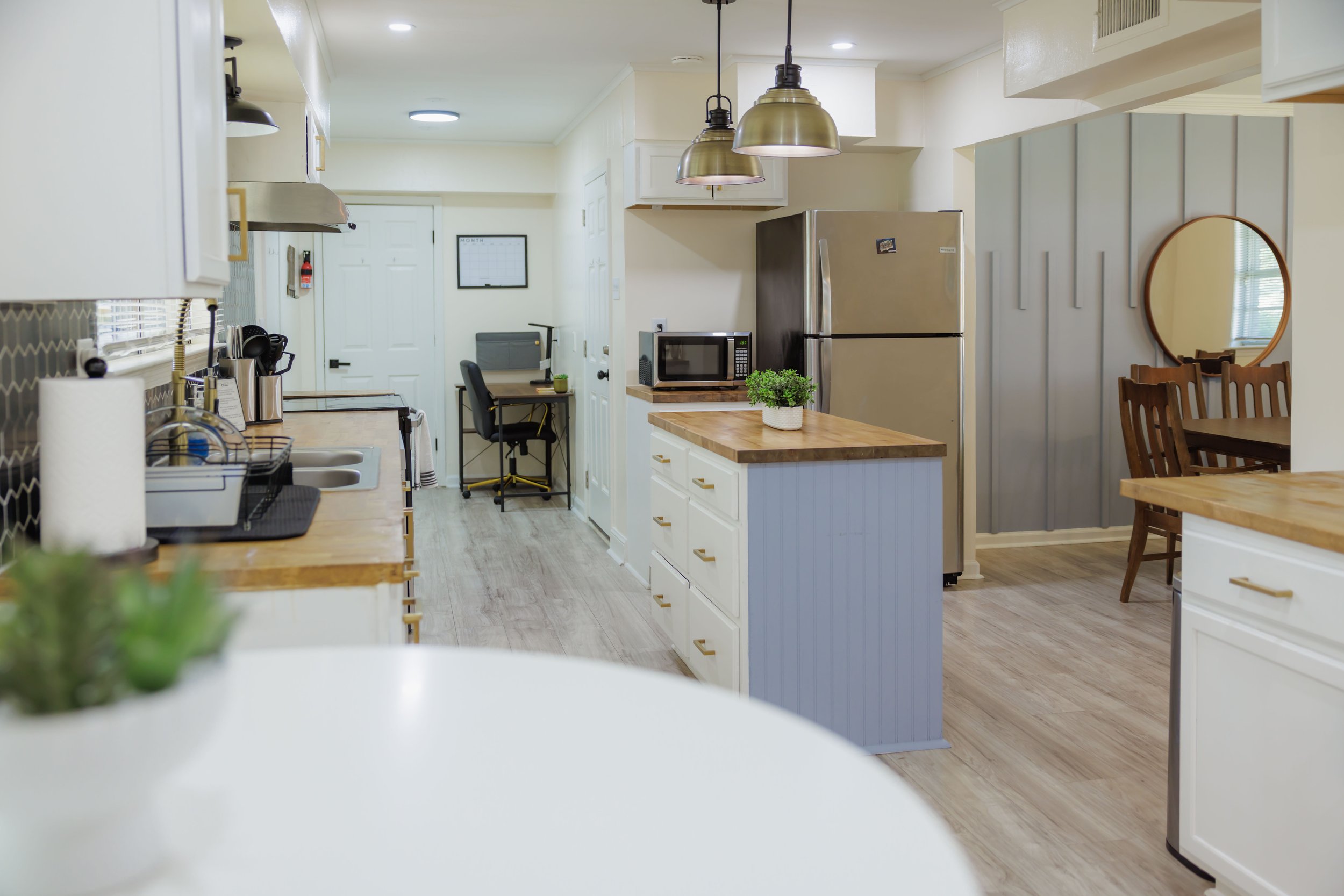 Fully equipped kitchen with spacious prep areas, modern appliances, and dedicated workspace for comfortable long-term living in Memphis.