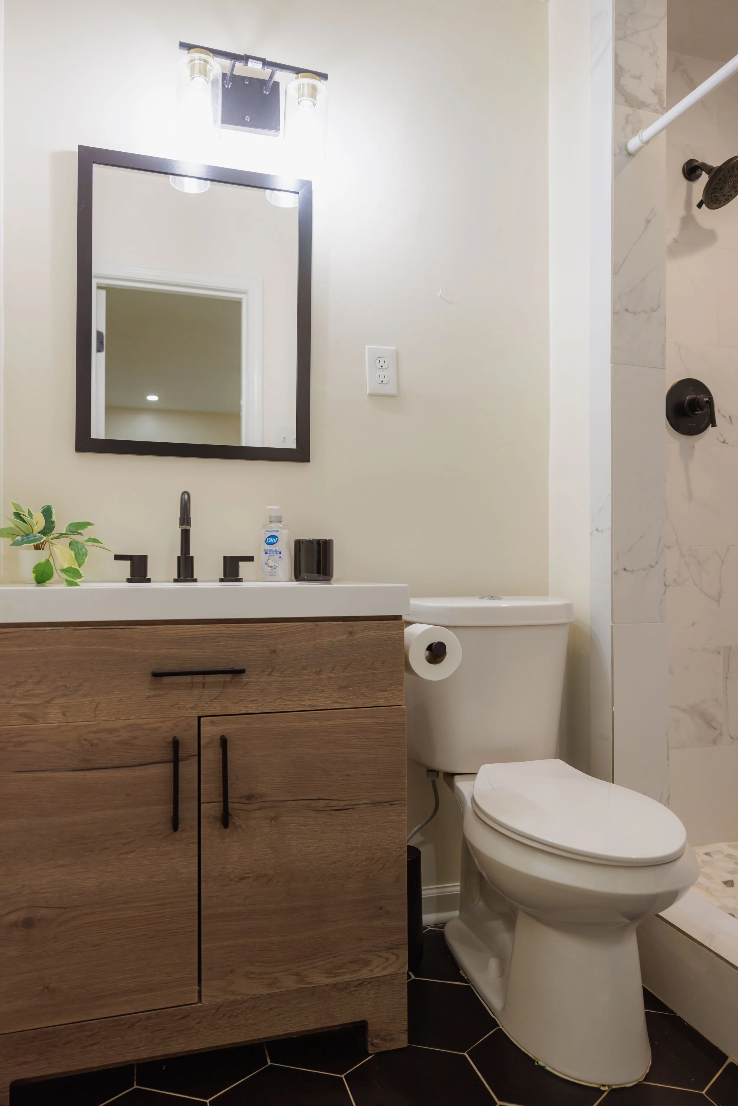 An updated ensuite with modern finishes and a clean, calming atmosphere.