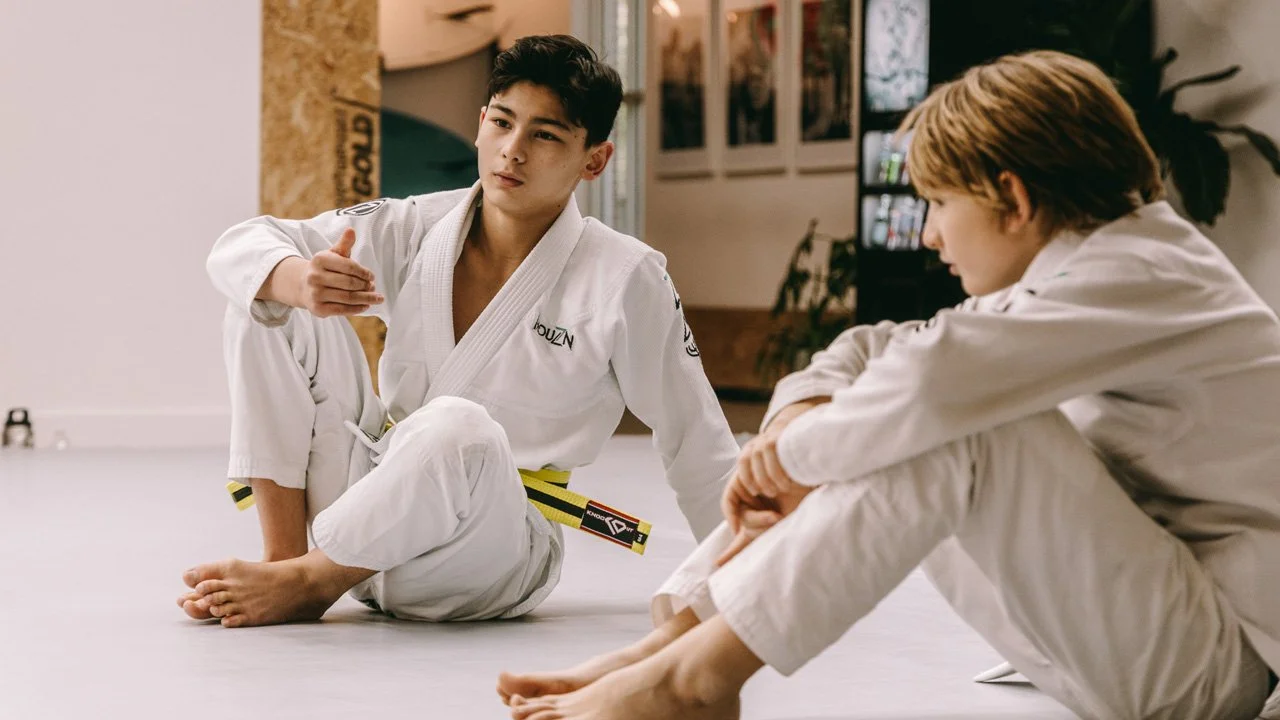 How Kids Earn Stripes in Brazilian Jiu Jitsu: Practice Hours, Skill, and Behavior