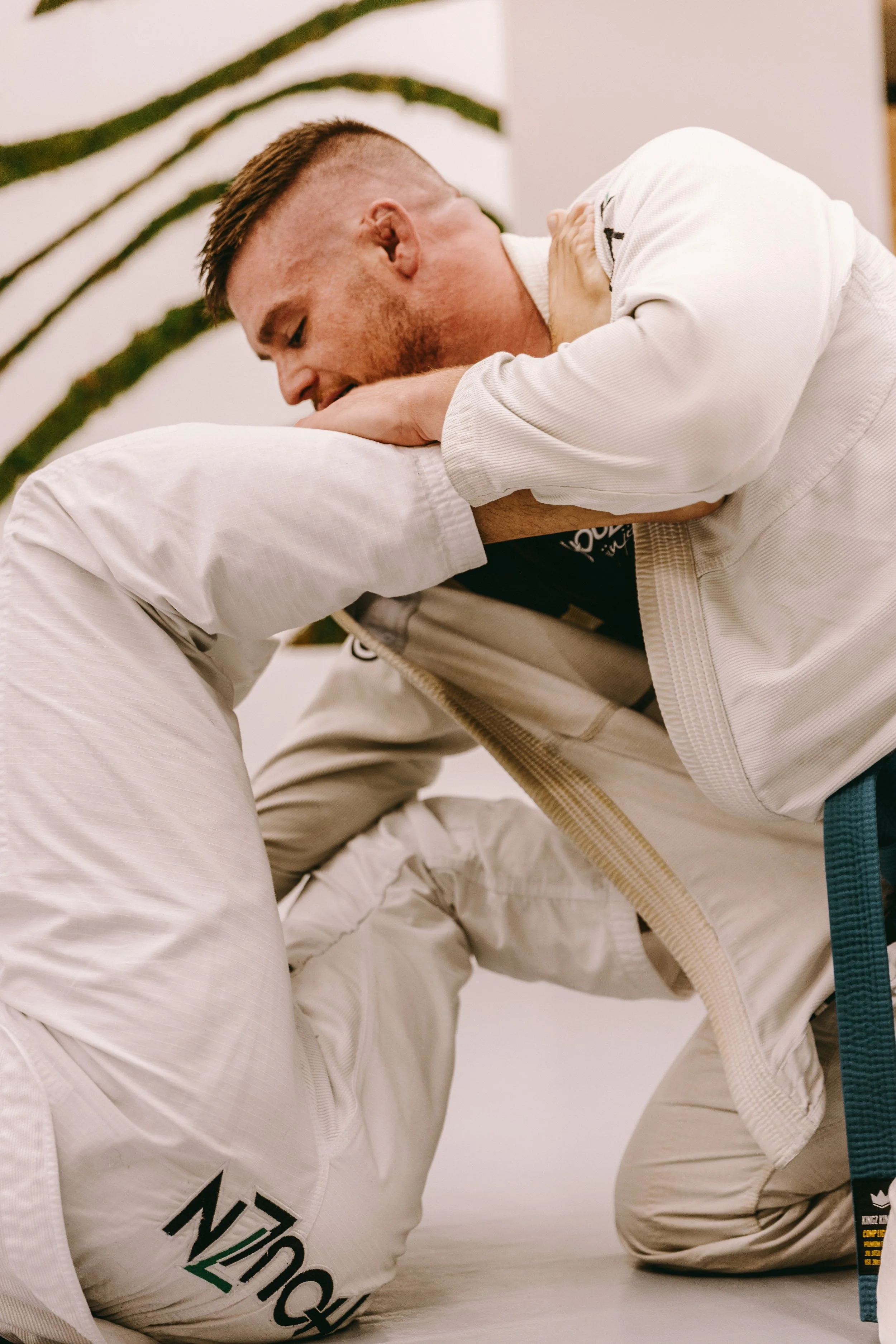Brazilian Jiu Jitsu sparring at Houzn Jiu Jitsu Academy showing technique over size
