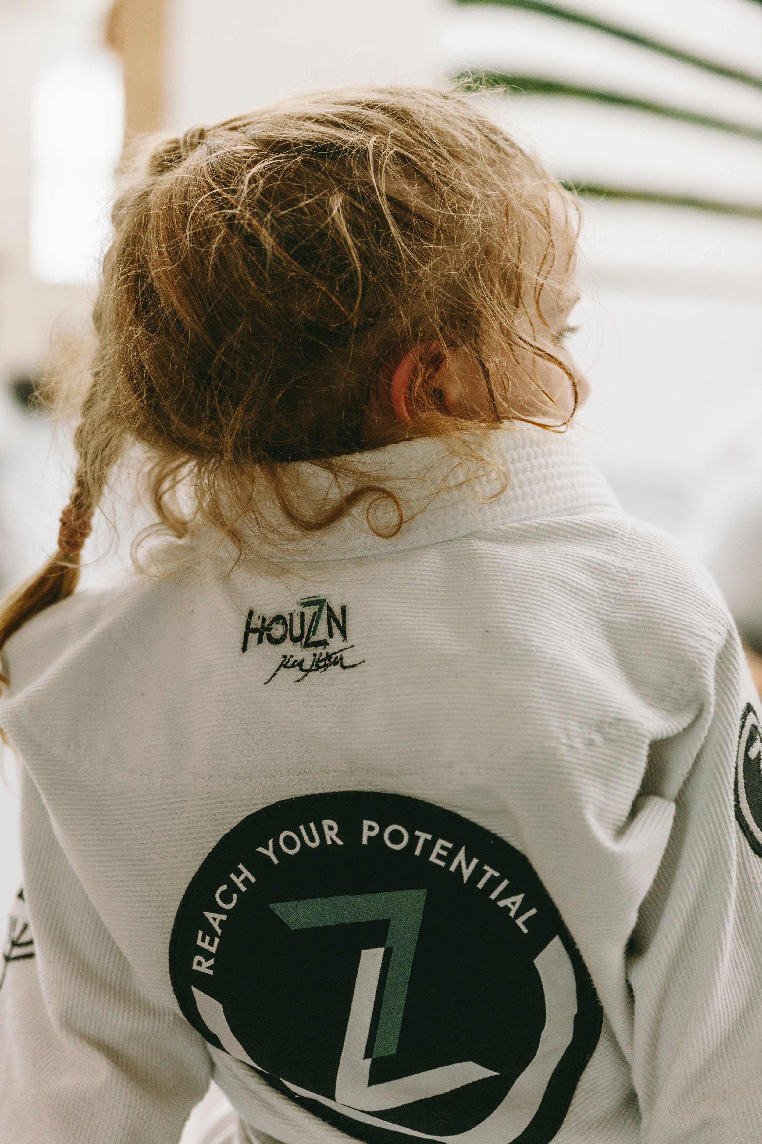 Kids listen to coaching during Brazilian jiu jitsu class at Houzn Jiu Jitsu Academy in Mount Pleasant, SC.