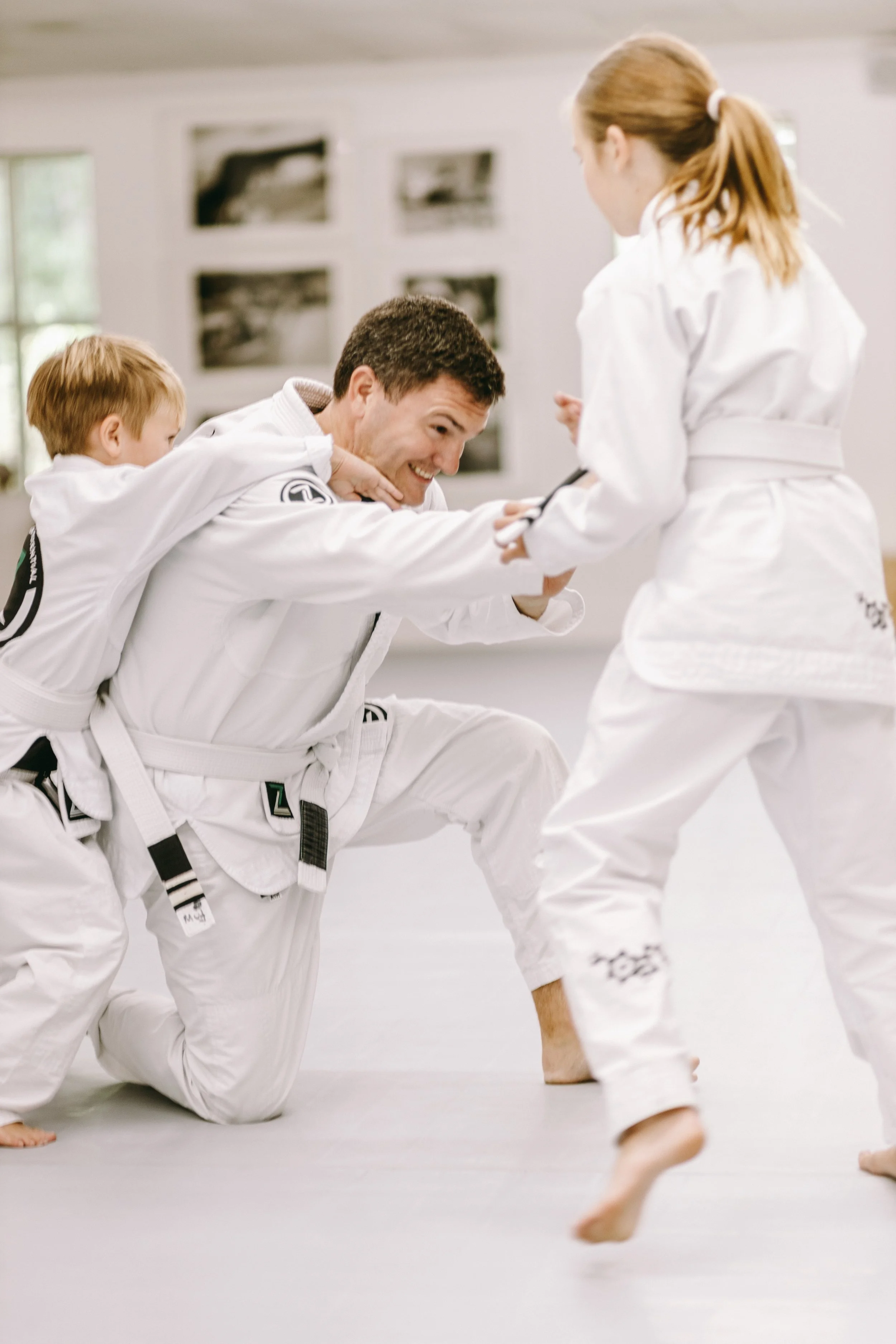 “Trey, Ford, and Lucy Harrell training together at Houzn Jiu Jitsu Academy”