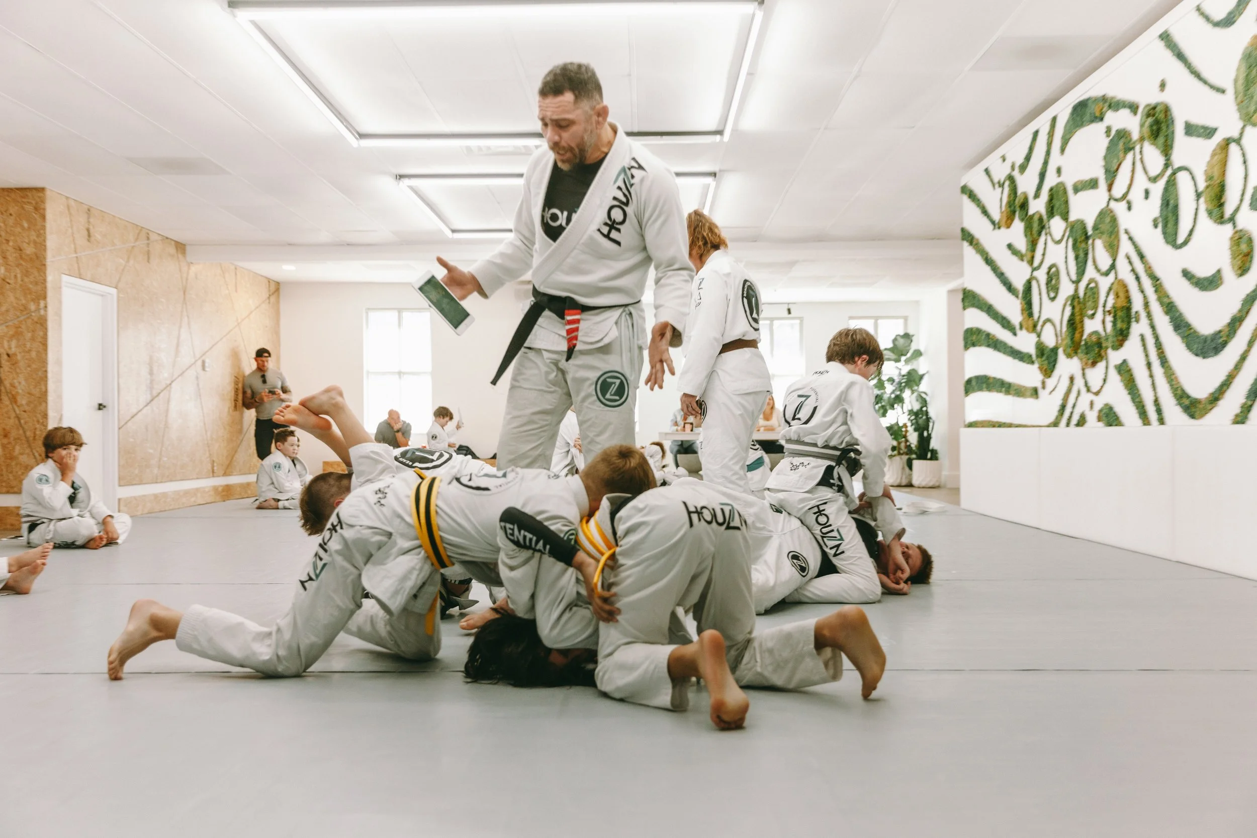 Kids Brazilian Jiu Jitsu class training under coach supervision at Houzn Jiu Jitsu Academy in Mount Pleasant, SC.