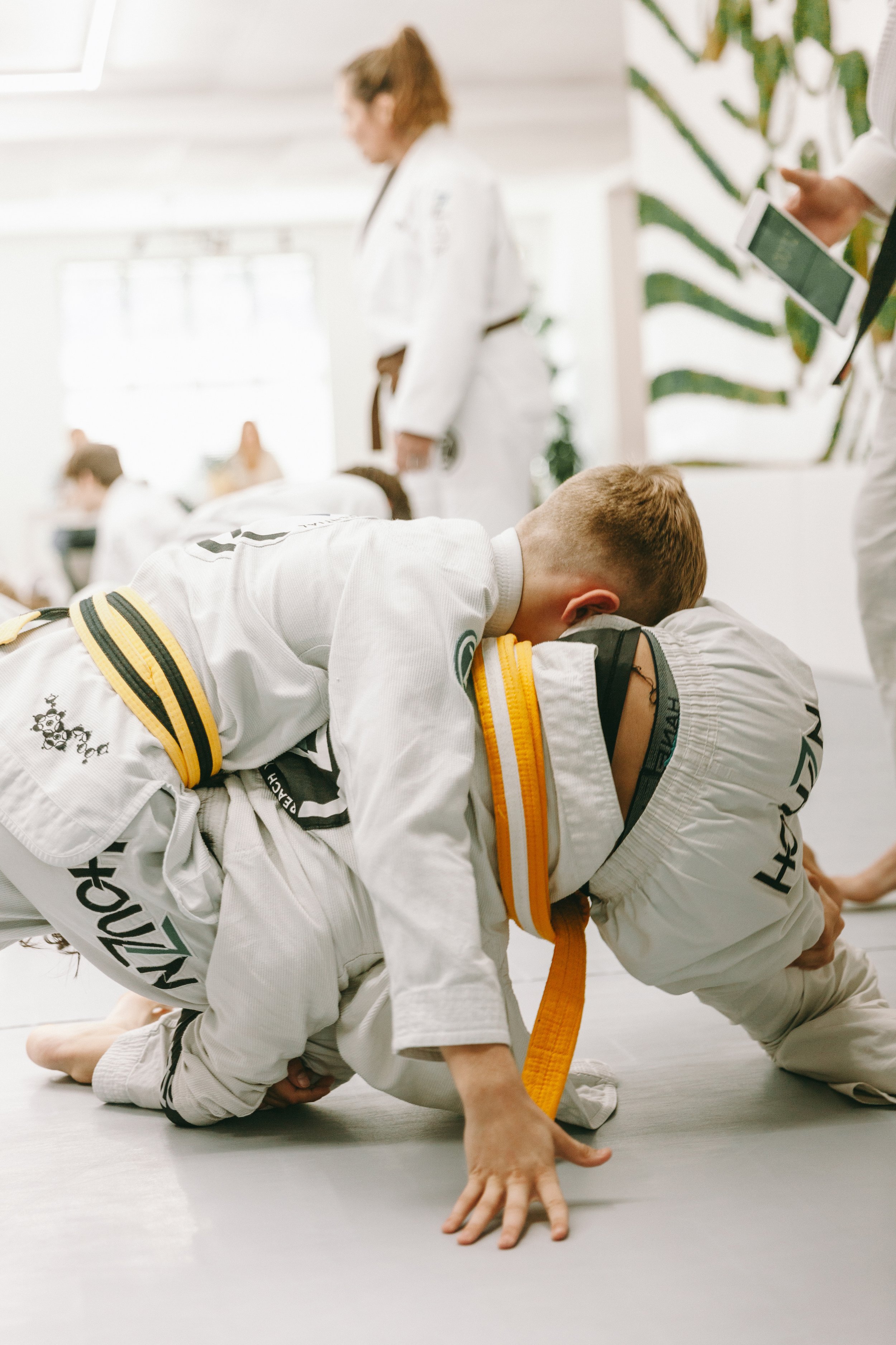 Kids practicing Brazilian jiu jitsu drills at Houzn Jiu Jitsu Academy in Mount Pleasant, South Carolina.