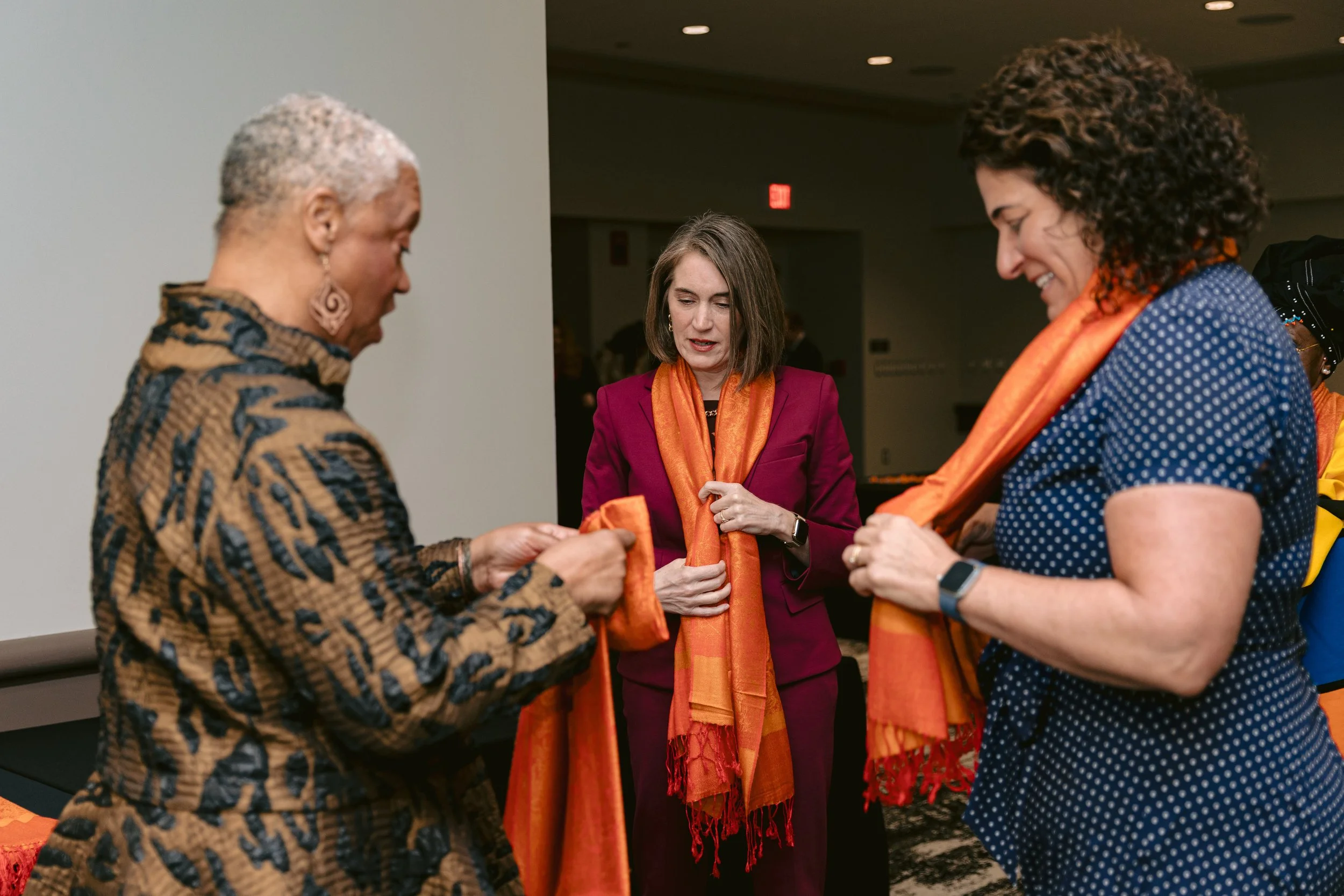 WOI 2026 tieing of scarfs.jpg