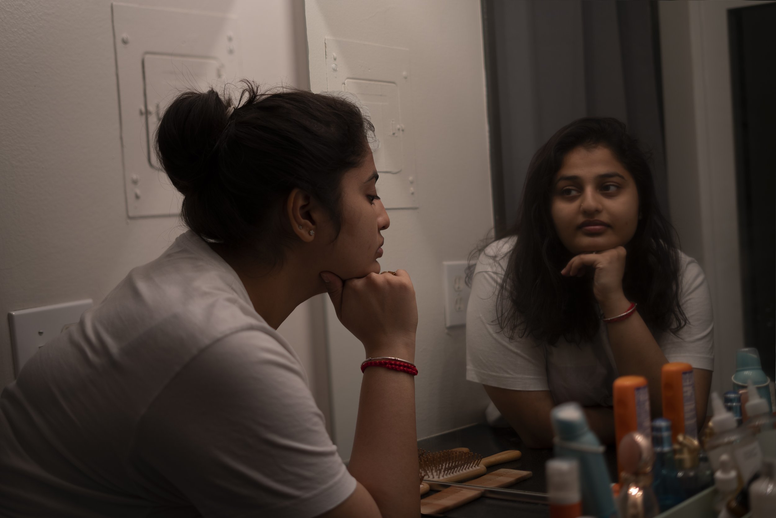 The mirror image is the one where Im representing myself. The cover I need to put on my face for the rest of the world when how I'm actually feeling is just the opposite. The tension, stress, and fear of just existing.