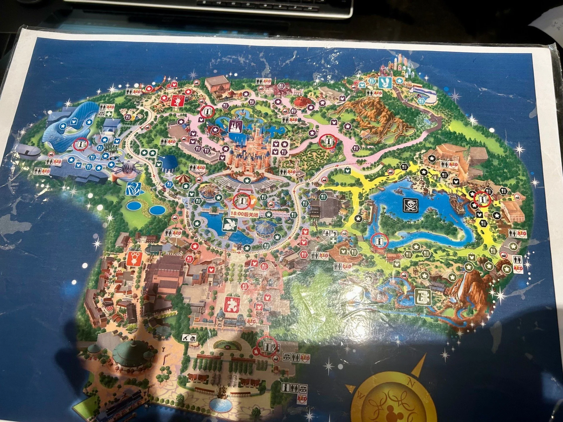 Detailed map of a Disney theme park, showing various rides, attractions, and landmarks, with key locations marked and color-coded.