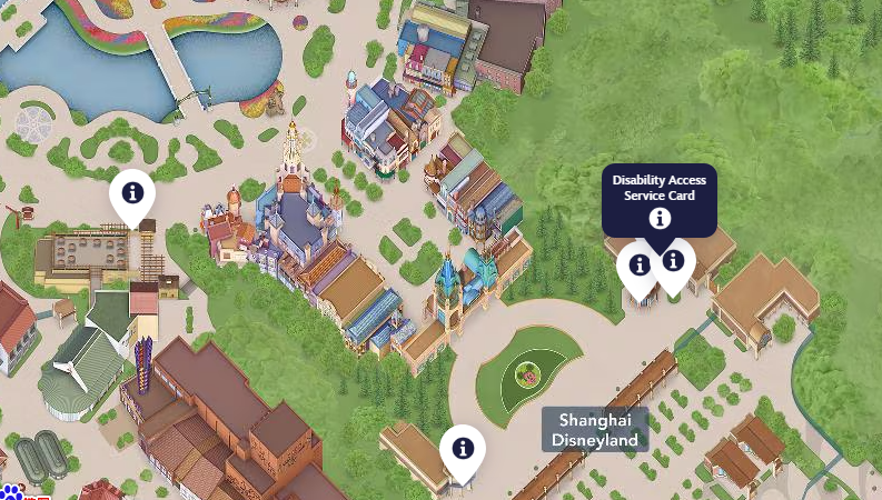Map of Shanghai Disneyland showing various attractions, buildings, and pathways, including a lake, a castle, informational markers, and a designated area for the Disability Access Service Card.
