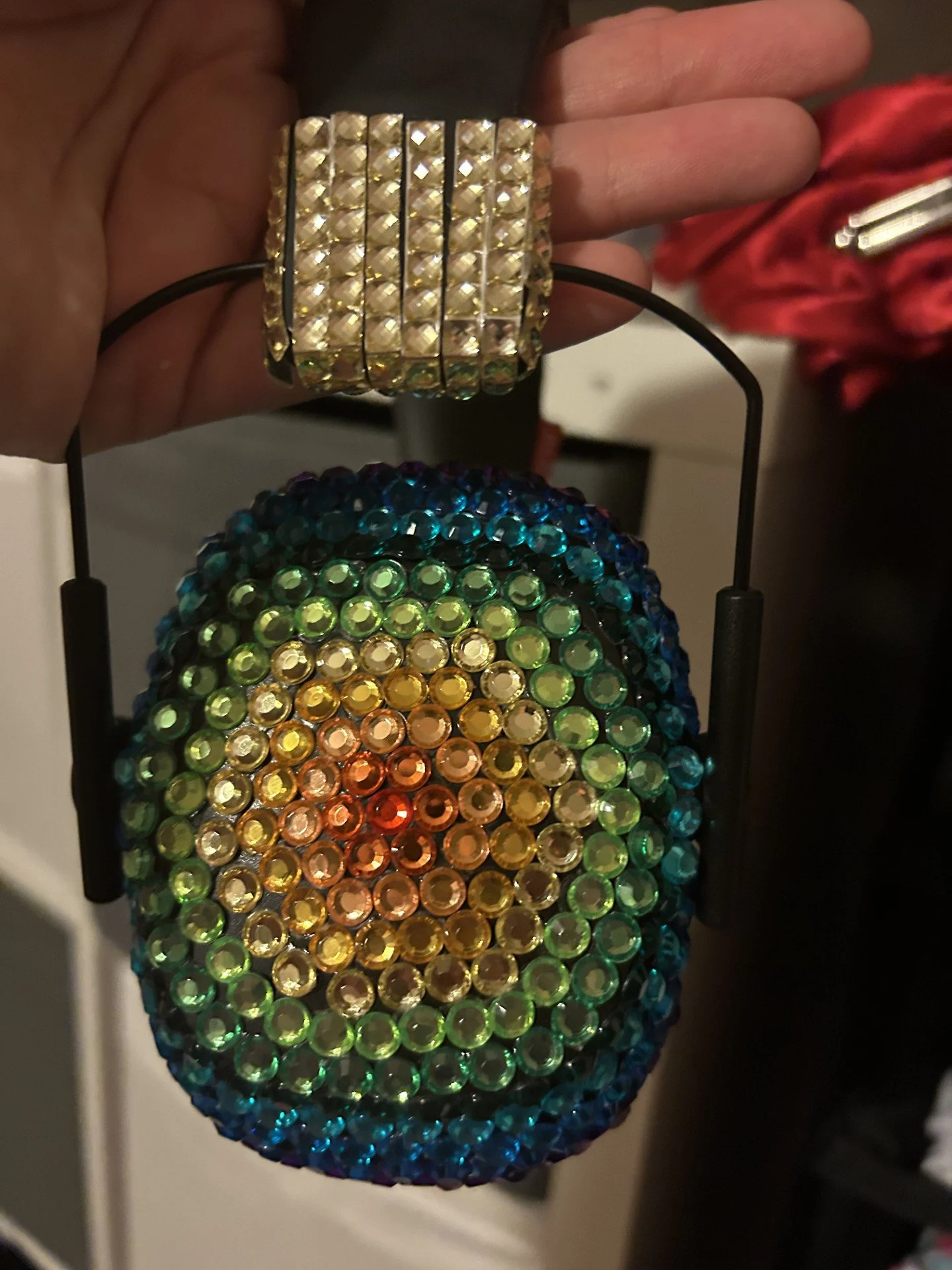 Colorful beaded headphone with rainbow pattern and a rhinestone-covered headband.