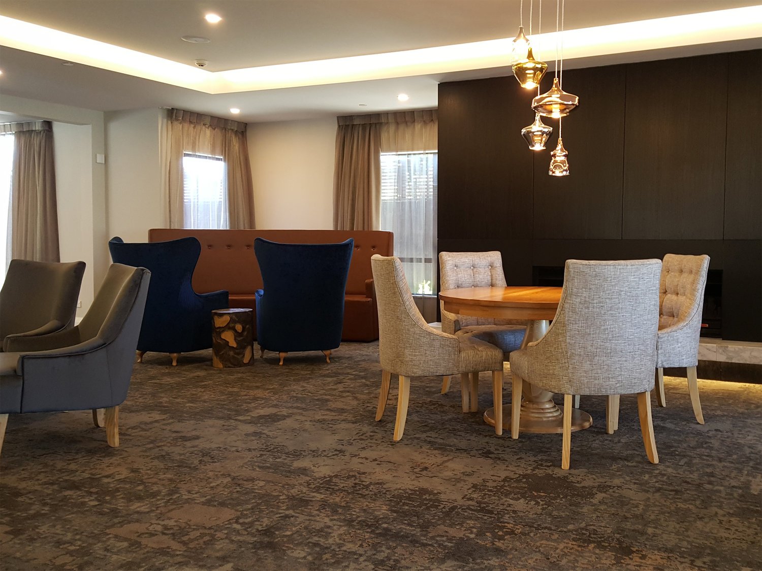 Chic healthcare interior with statement hanging glass lights, New Zealand.