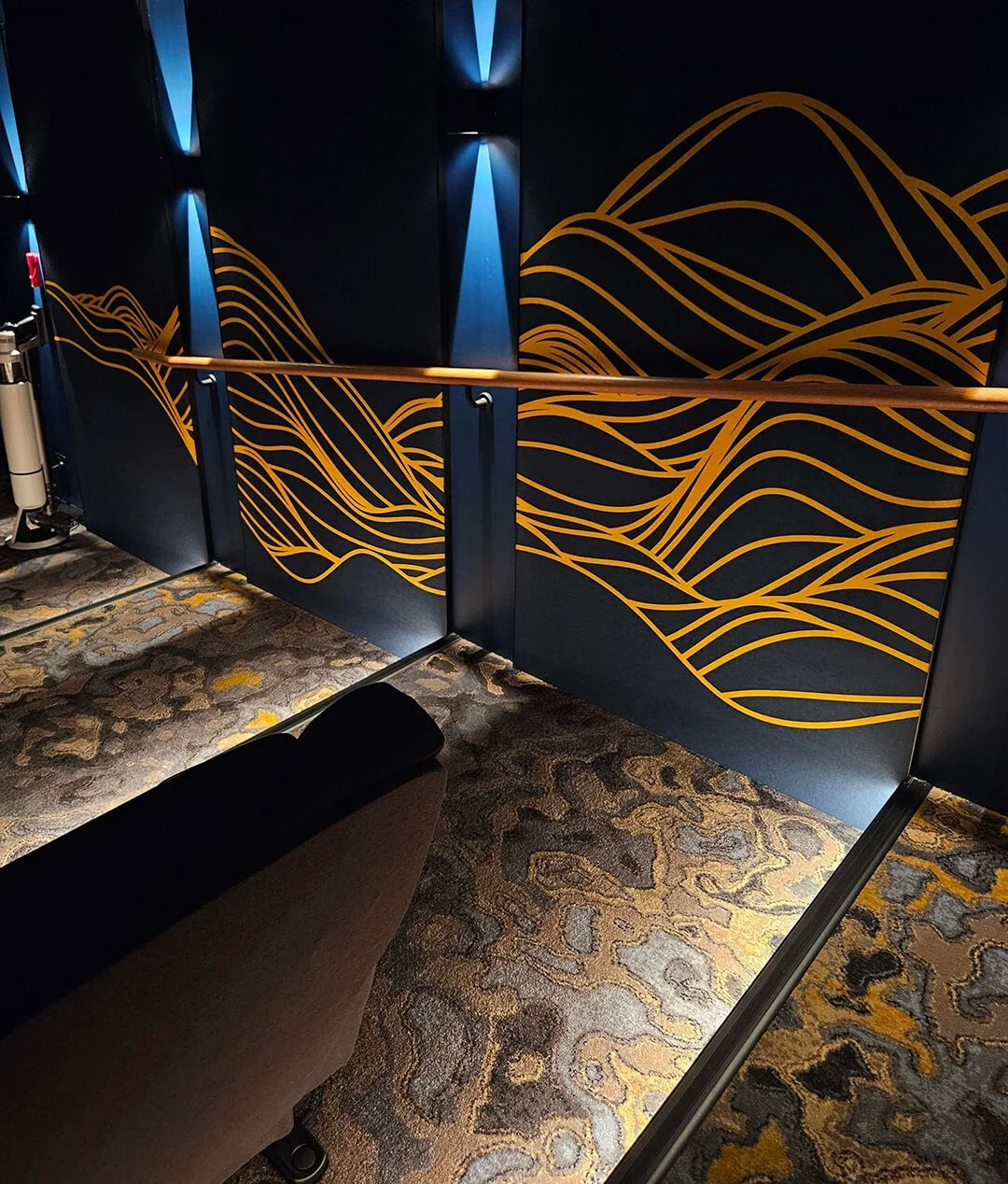 Boutique cinema seating with plush textures and ambient lighting for a luxury home theatre.