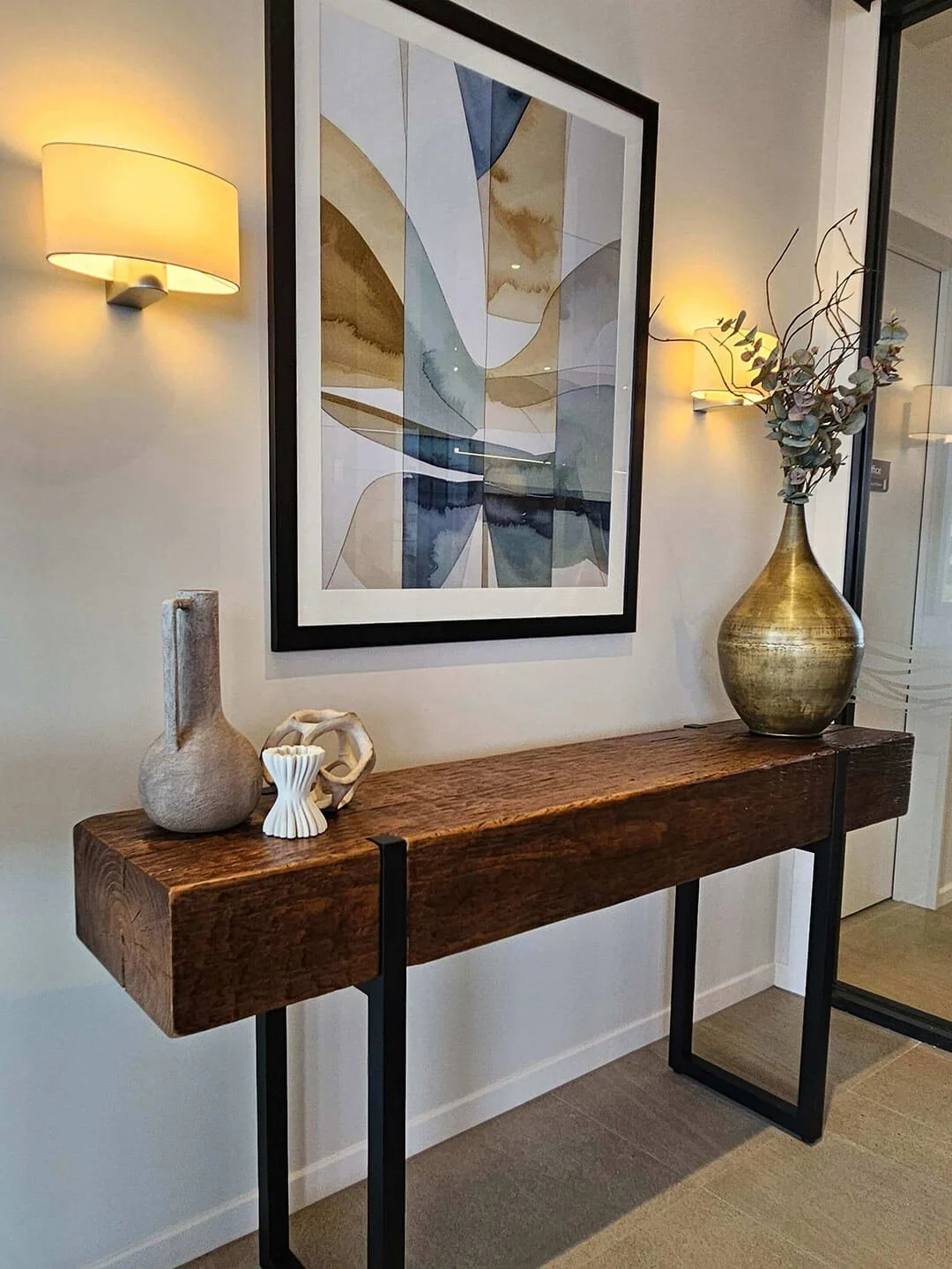 Contemporary artwork styling in a refined interior, balancing colour and calm.