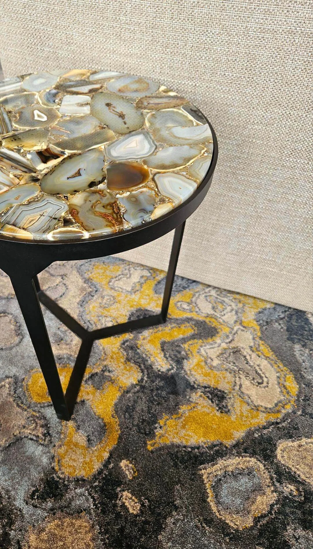 Bespoke side table featuring organic stone inlay, highlighting natural materials and artisan craftsmanship.