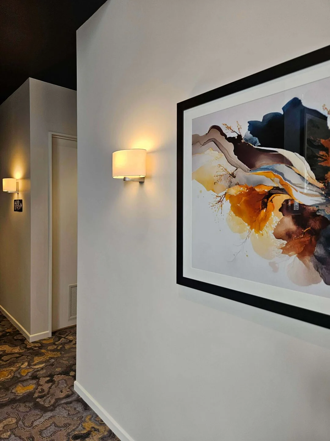 Minimalist hallway with soft lighting and natural finishes, enhancing flow and tranquillity.