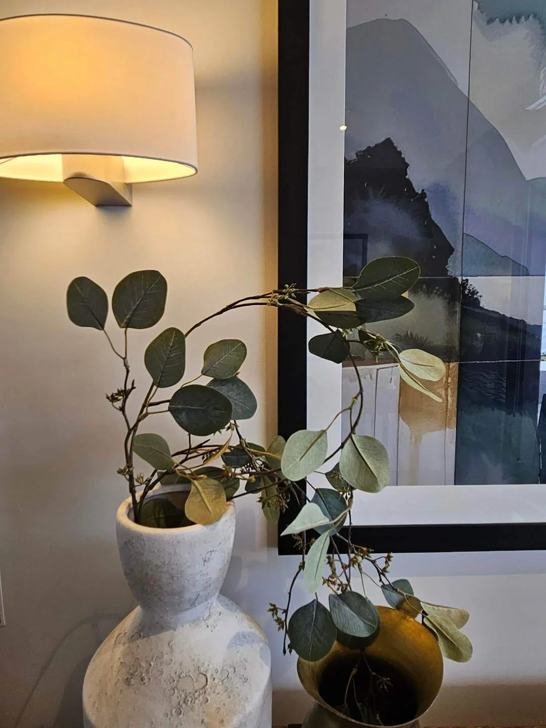 Custom console vignette with natural decor elements, styled for a serene entryway experience.