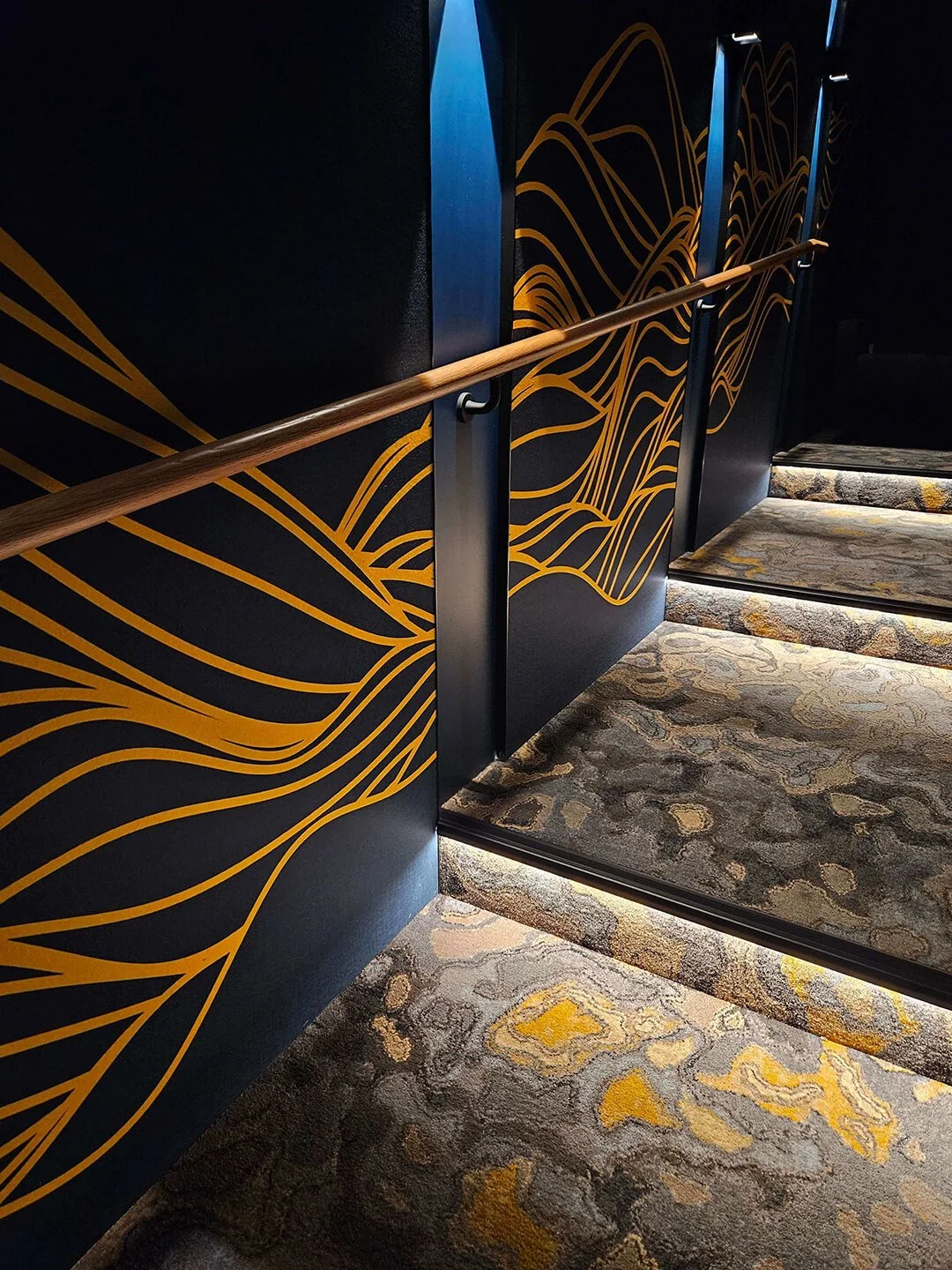 Feature staircase with artistic balustrade, blending function with sculptural design.