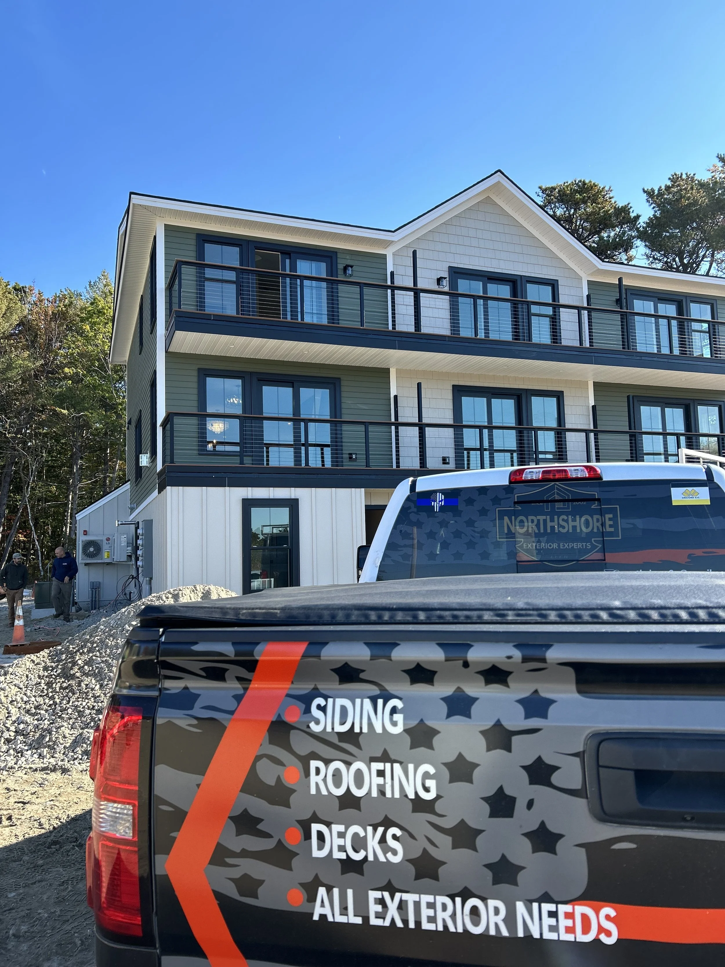 North Shore Exteriors truck in front of modern home