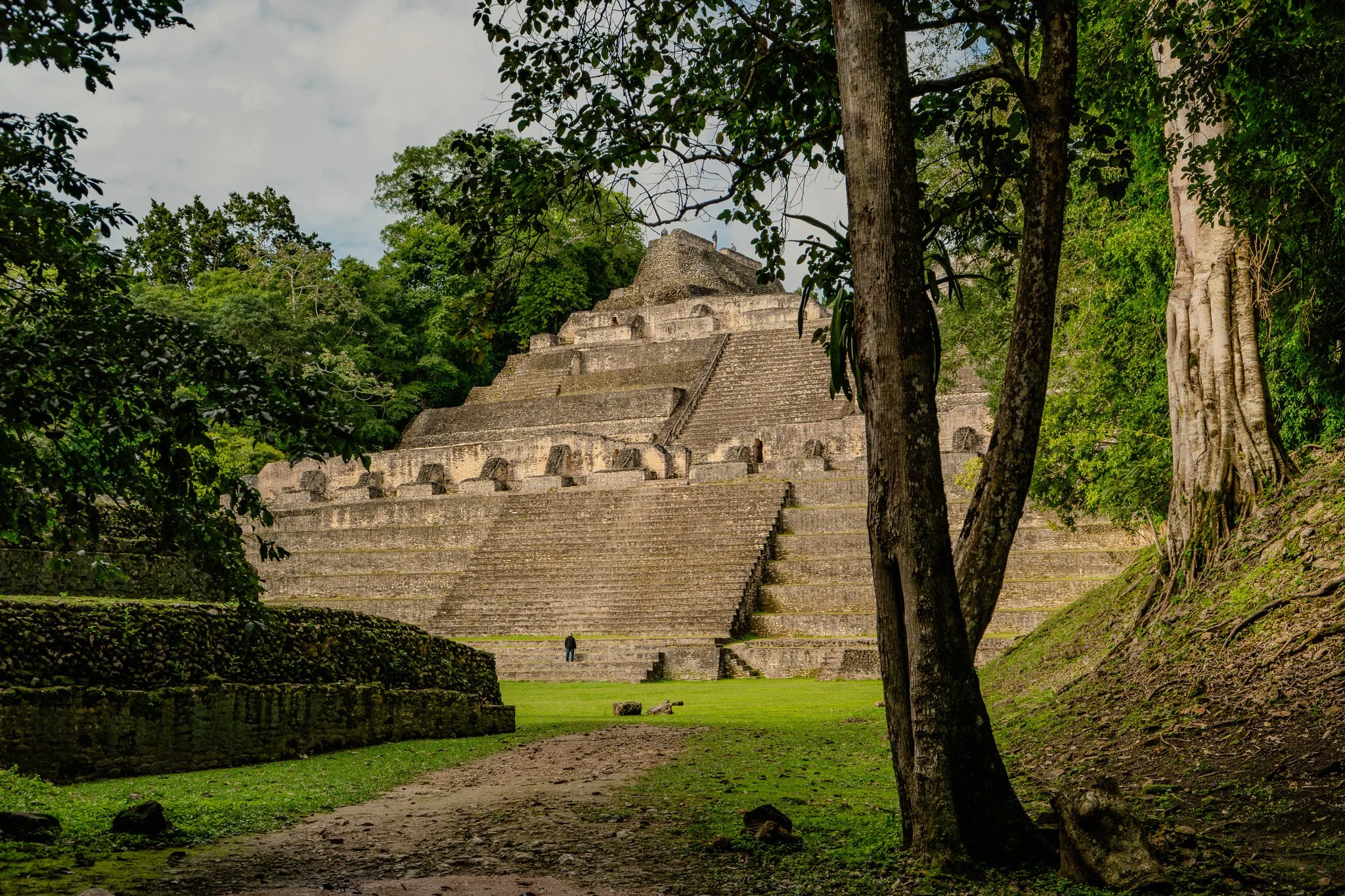 Filled with anticipation, a woman braces herself at the edge of the Black Hole Drop Sinkhole, ready for the descent.