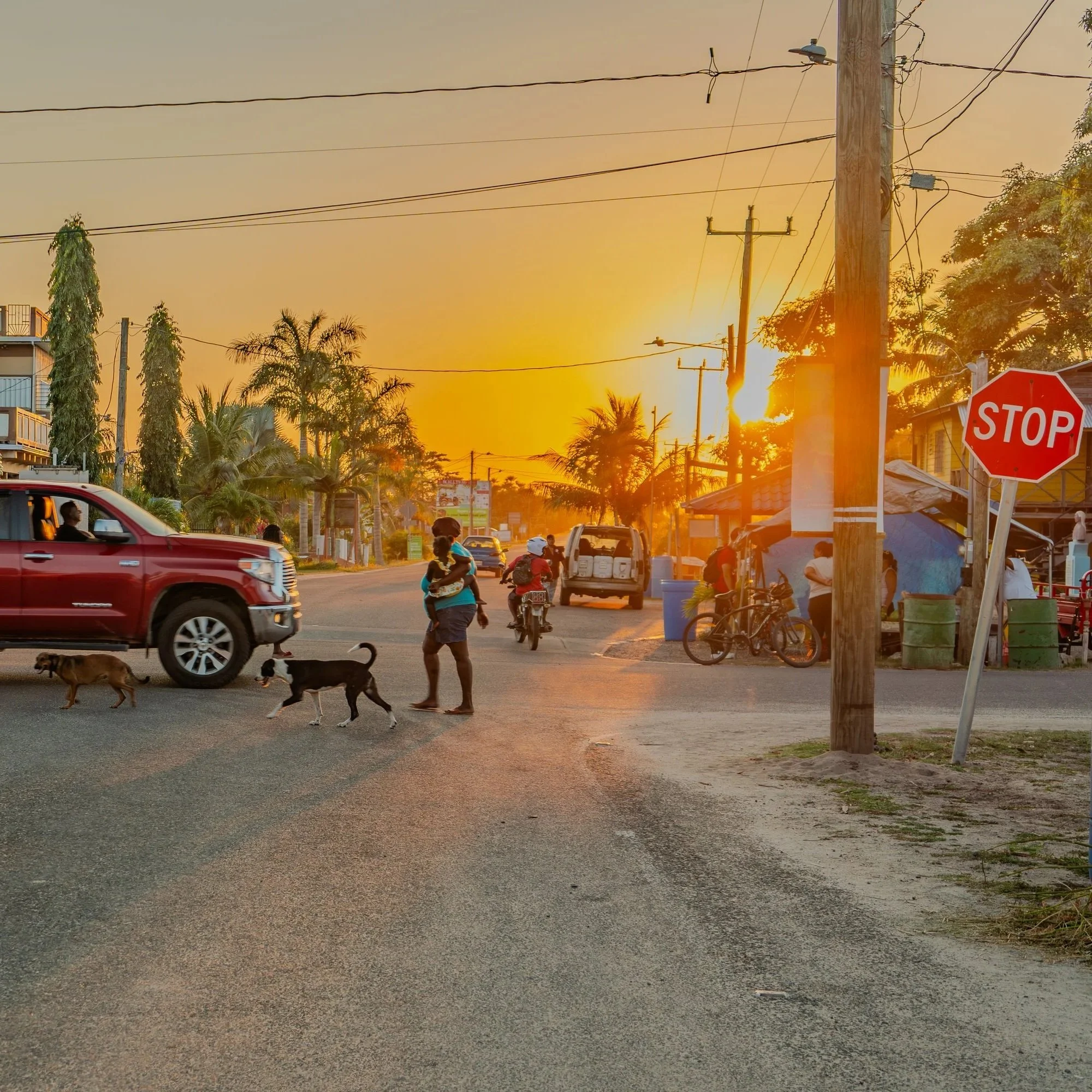 In a hidden corner of the cave, a guide and explorer uncover an ancient Maya shoe pot, a glimpse into history amidst the darkness.