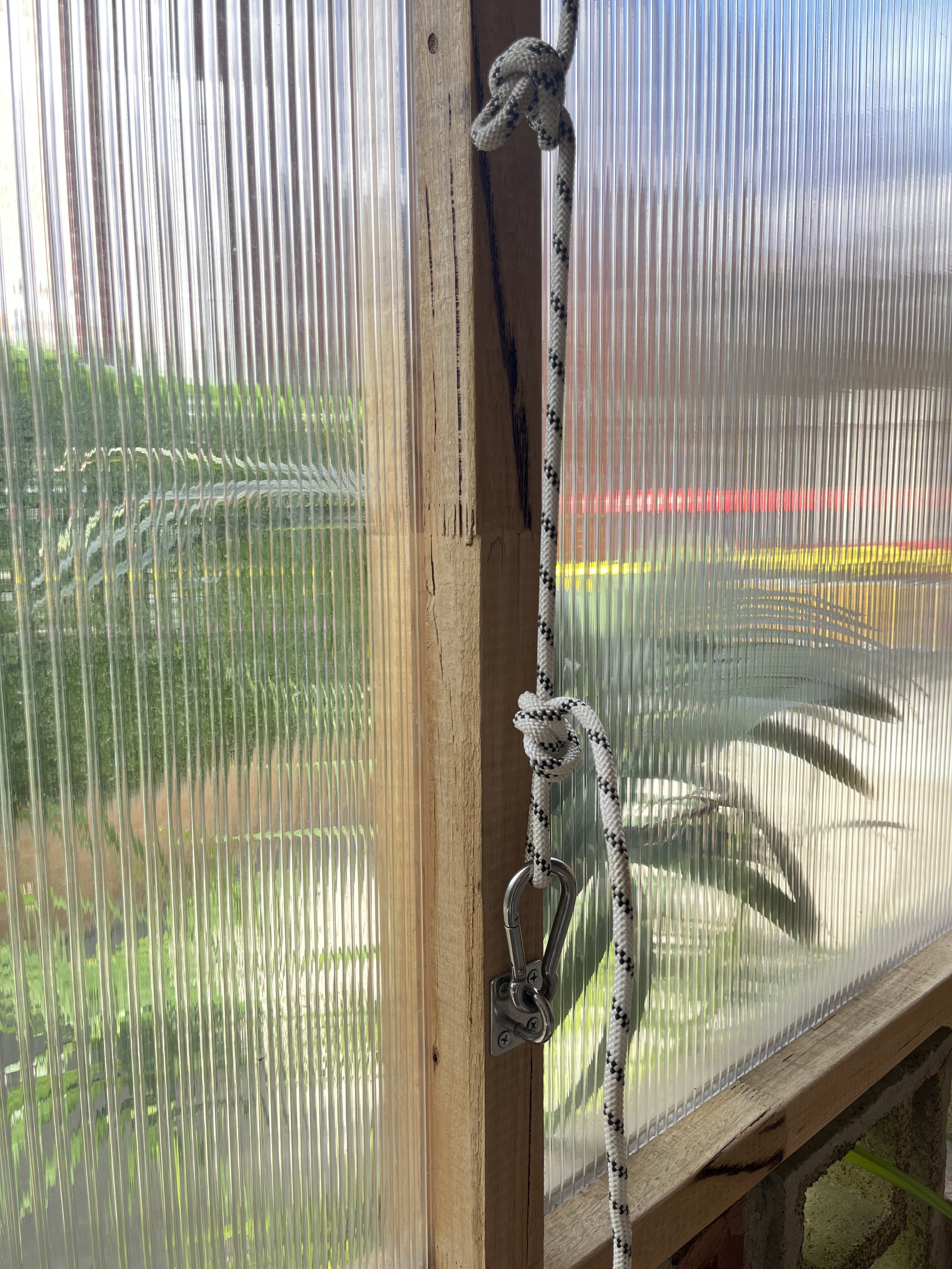 Step 5. Close all courtyard windows by opening each carabiner and unhooking the rope loops