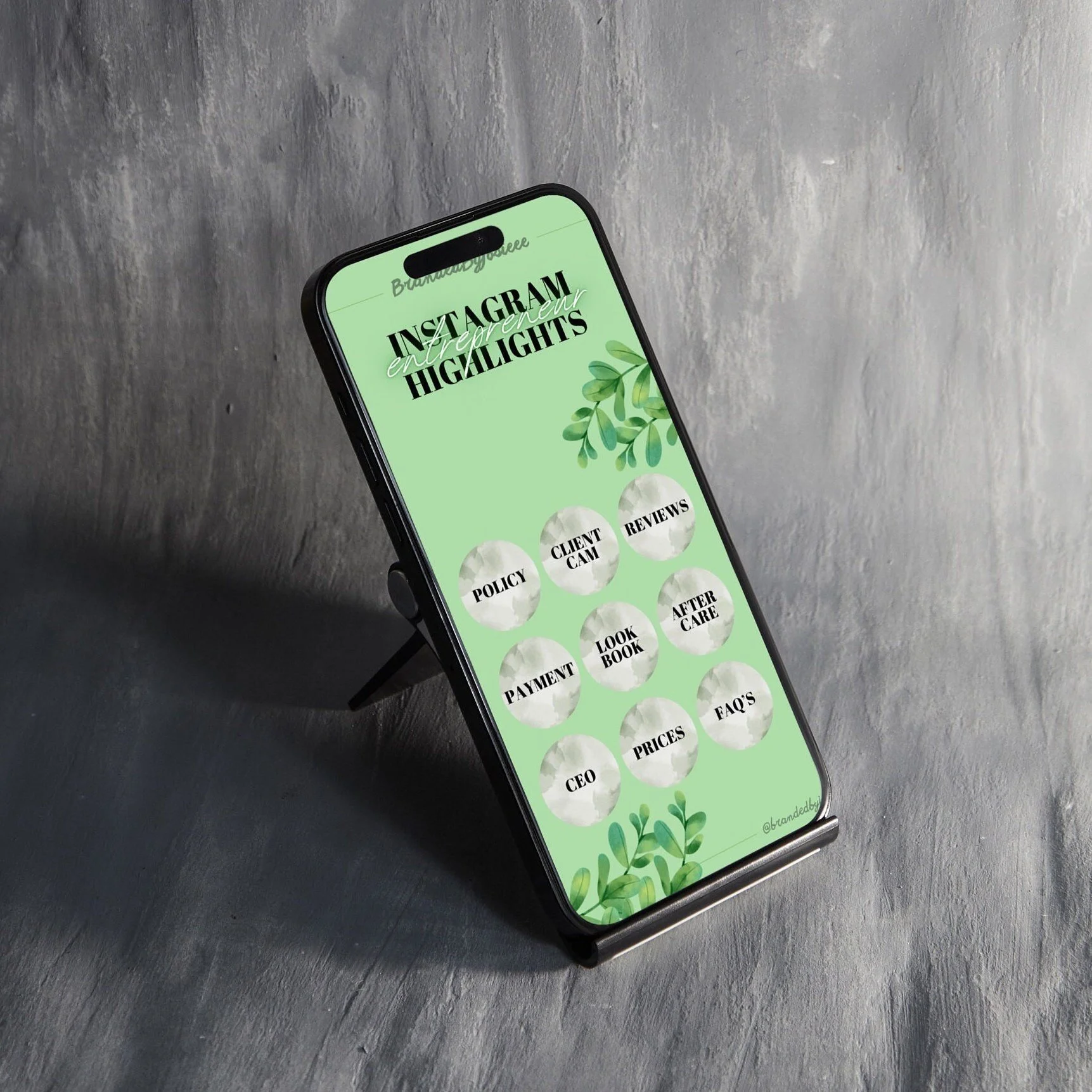 Smartphone displaying Instagram highlights menu with options including policy, client cam, reviews, payment, look book, after care, FAQ's, CEO, prices, and contact information on a grey textured background.